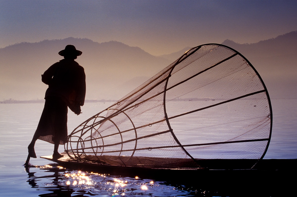 Inle Lake - Intha fisherman rows helping by the foot