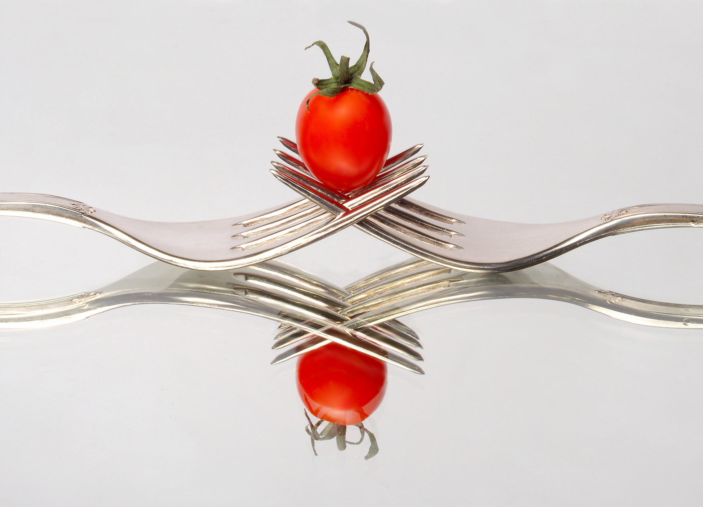 Forks and tomato