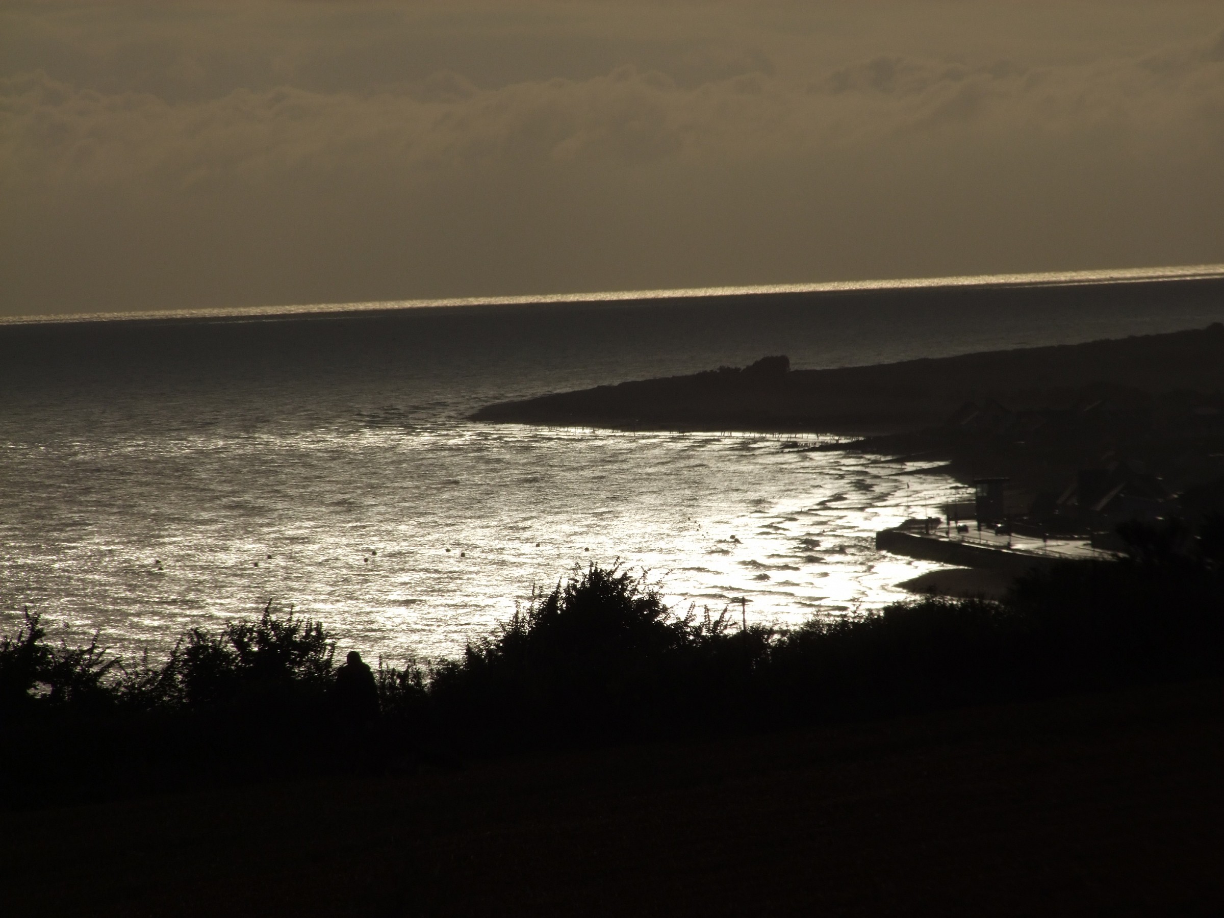 sunset at arromanches: peace after the storm ....