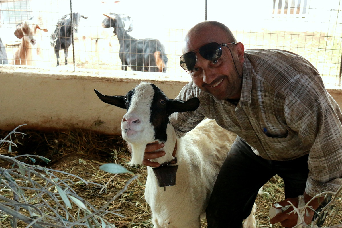 Happy with his goat