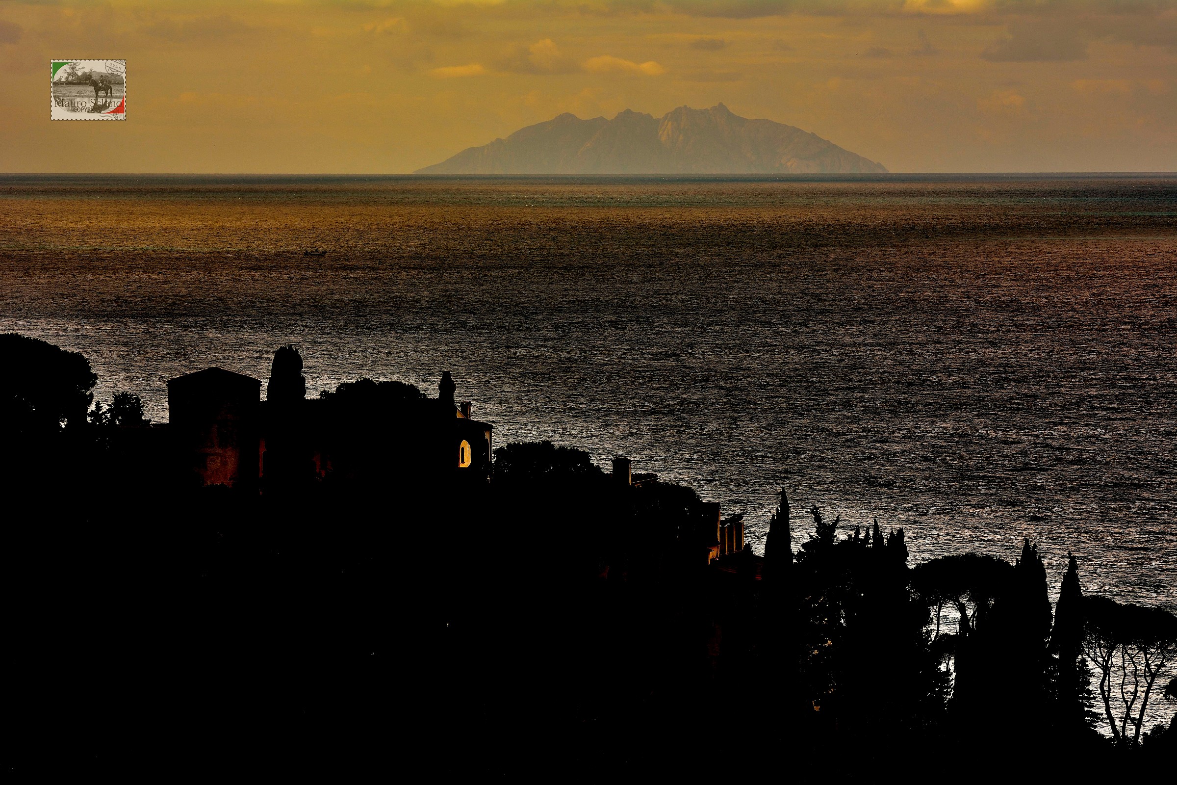 Montecristo at sunset from Monte Argentario
