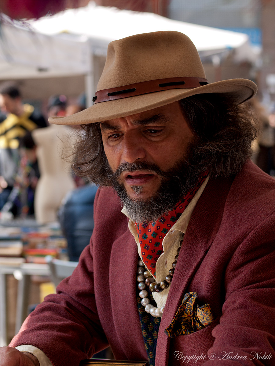 Seller of beads and shells in the historic market of Portapo...