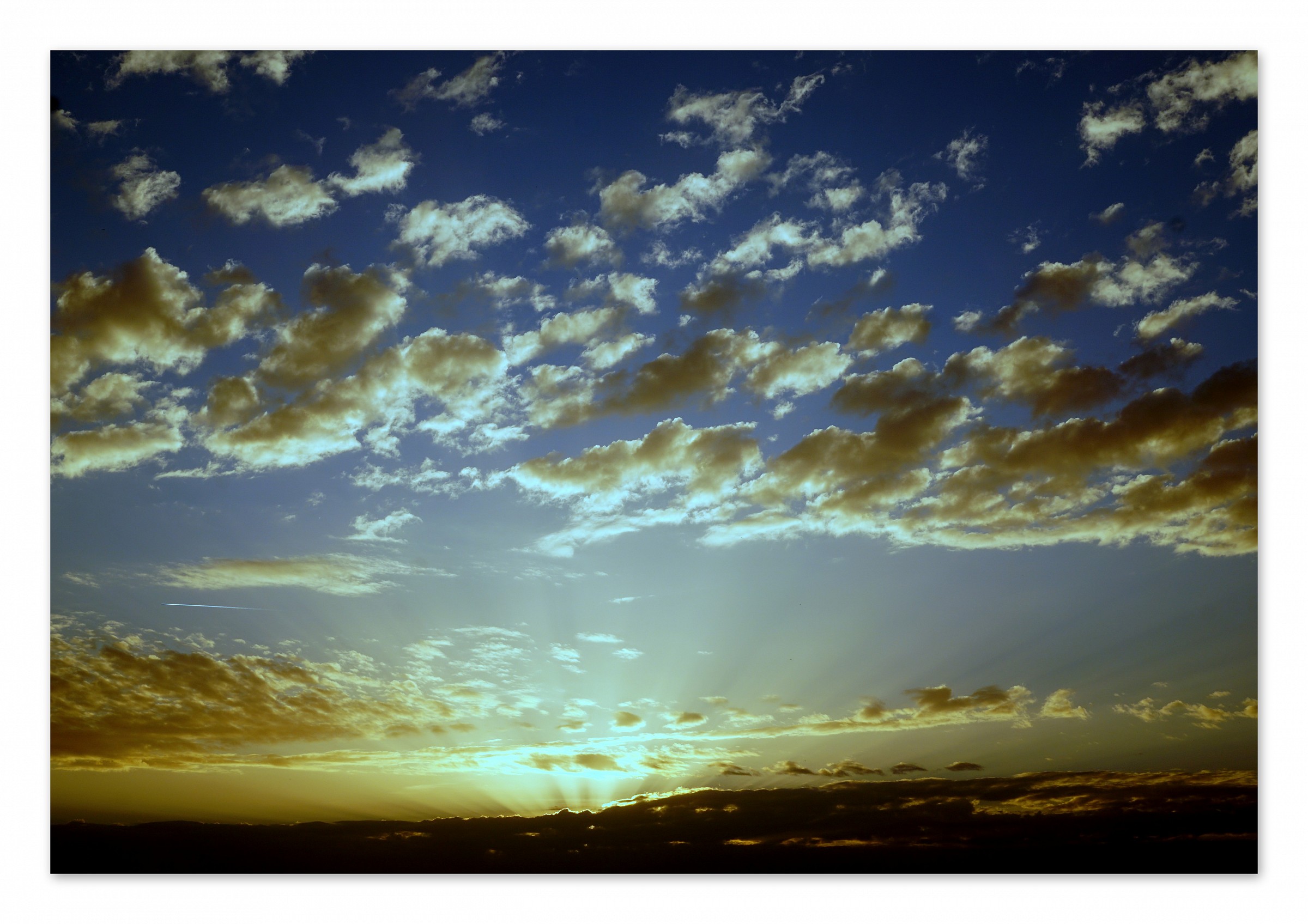clouds spanking from the sun