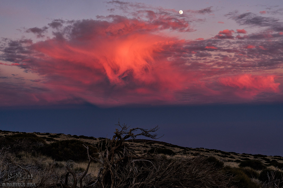 Clouds between the sun and moon