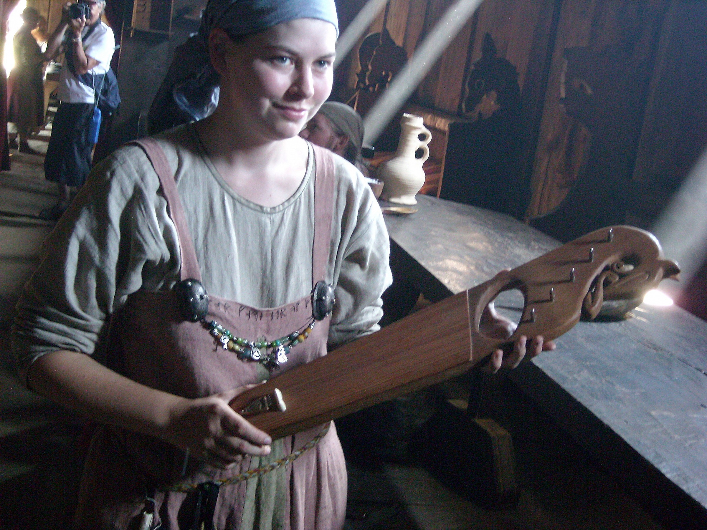 Viking girl with ancient instrument