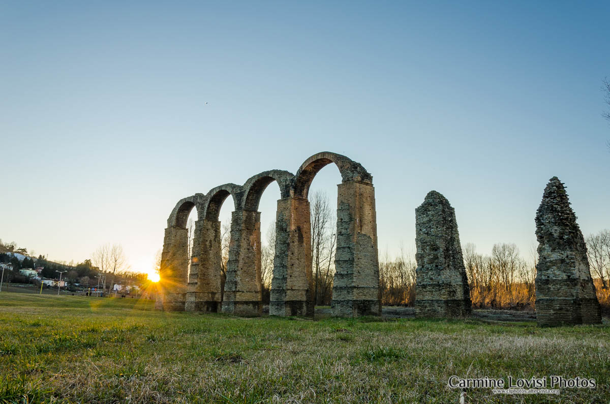 Roman aqueduct at sunset