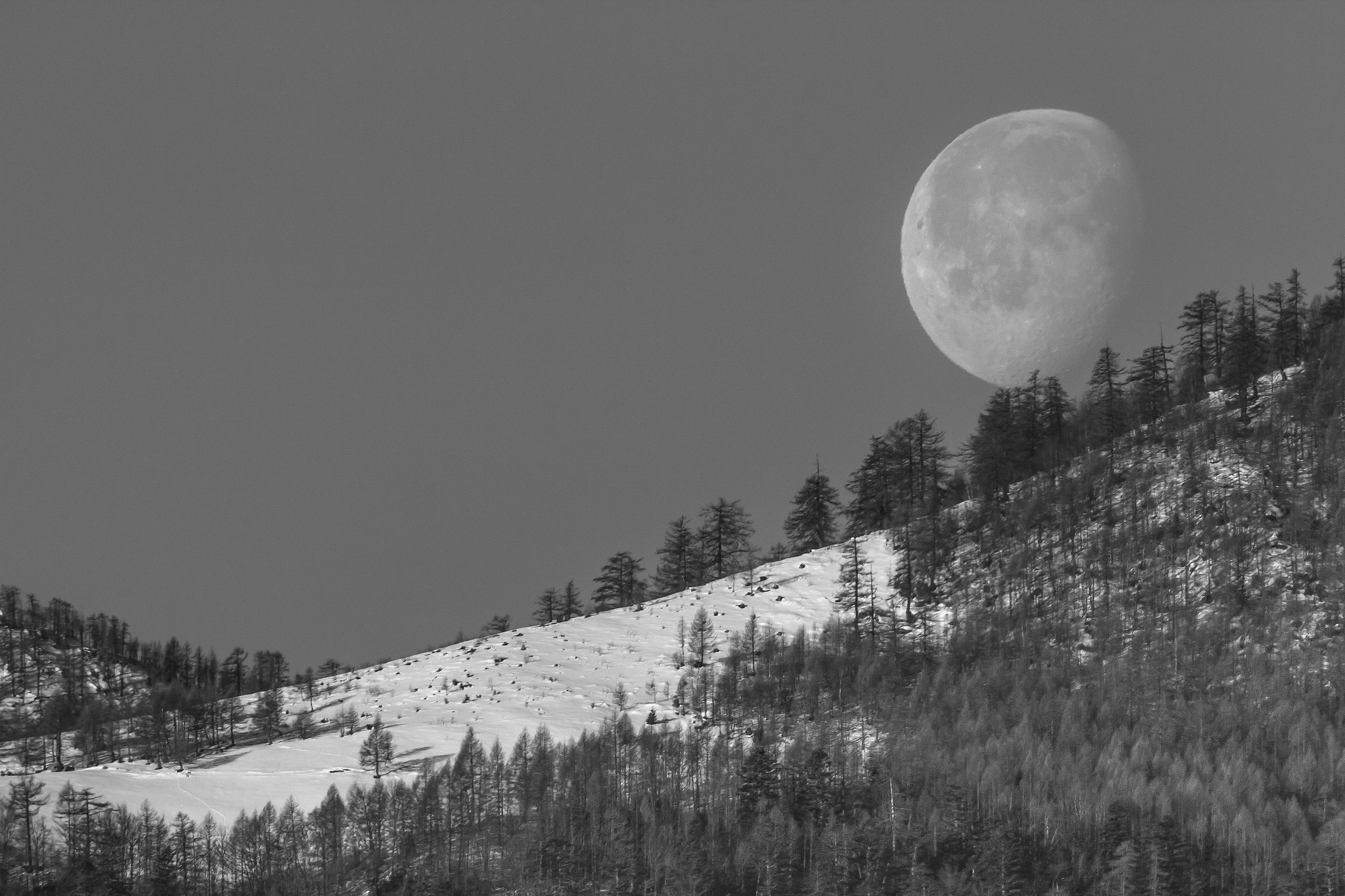the moon descends from the mountain