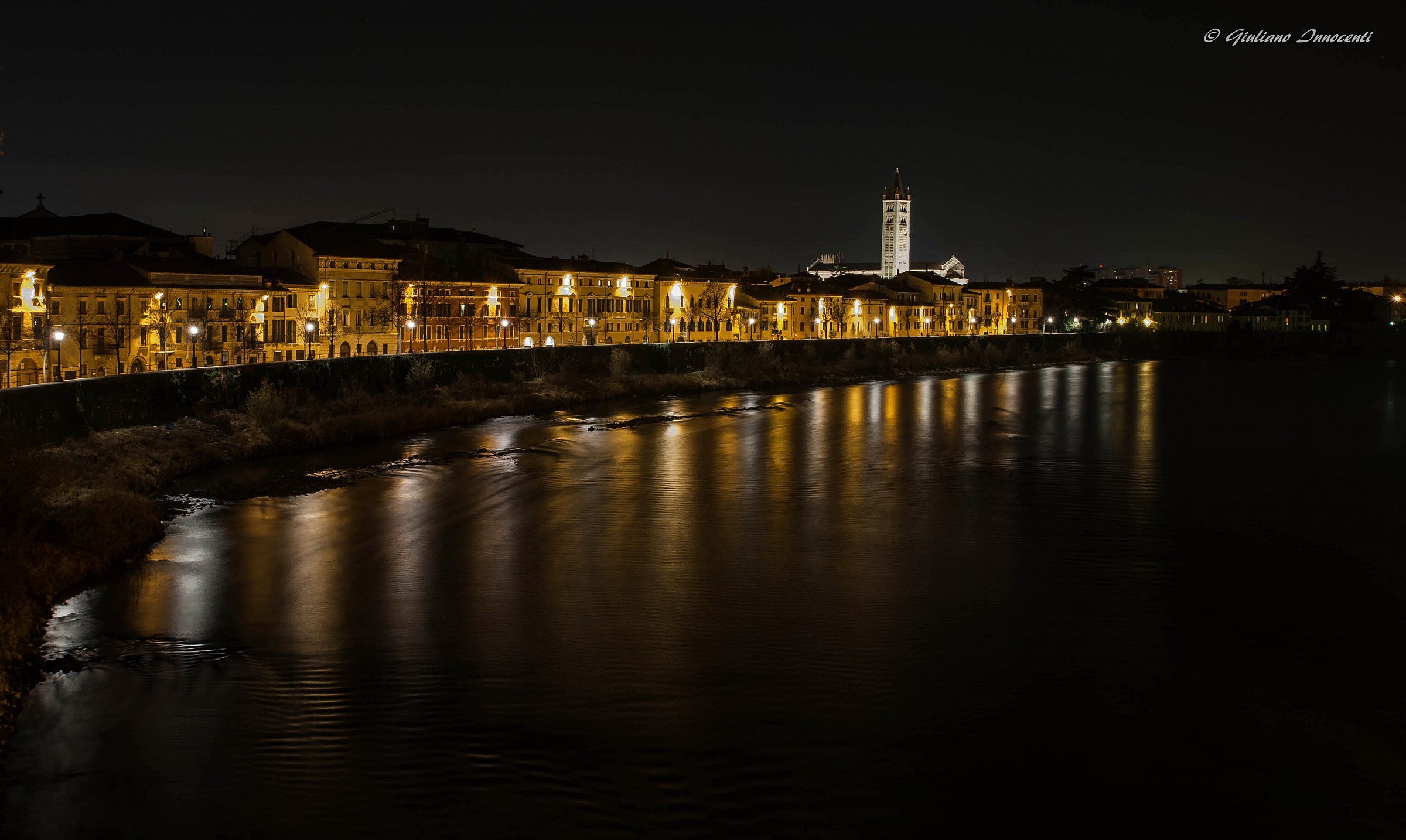 lights and reflections on the shore dell'adige