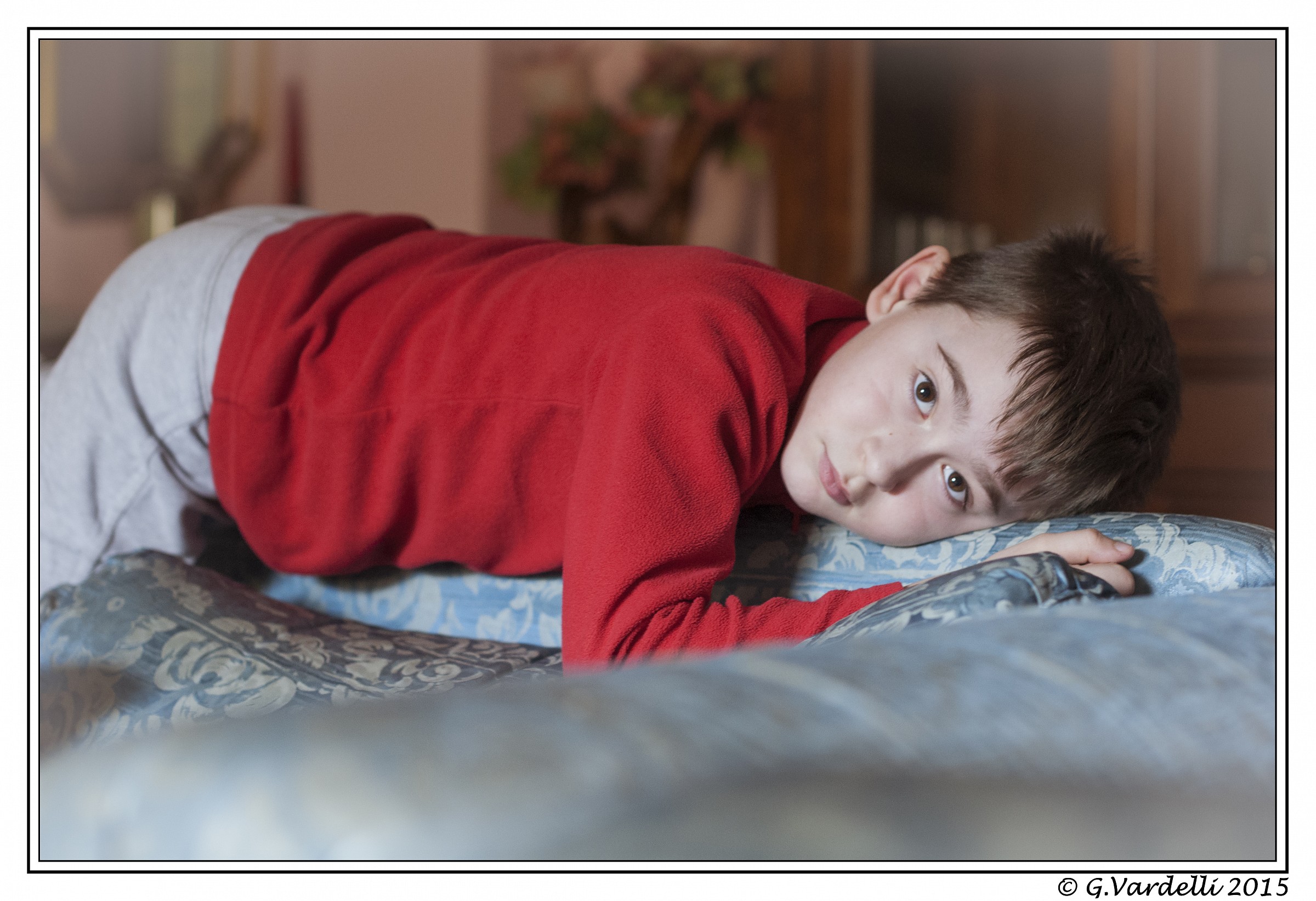 On the couch of her grandmother.