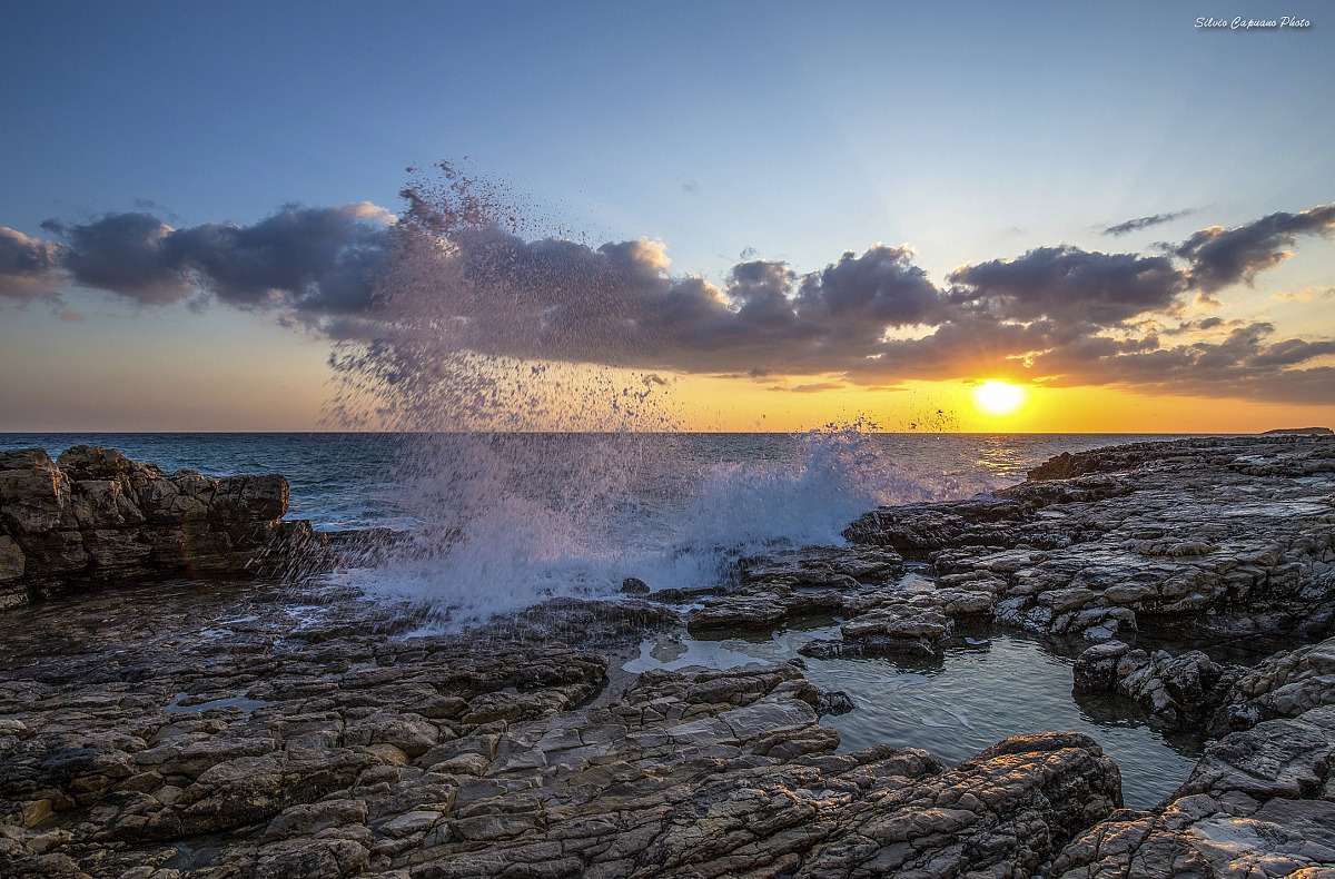 Dawn between rocks and sea