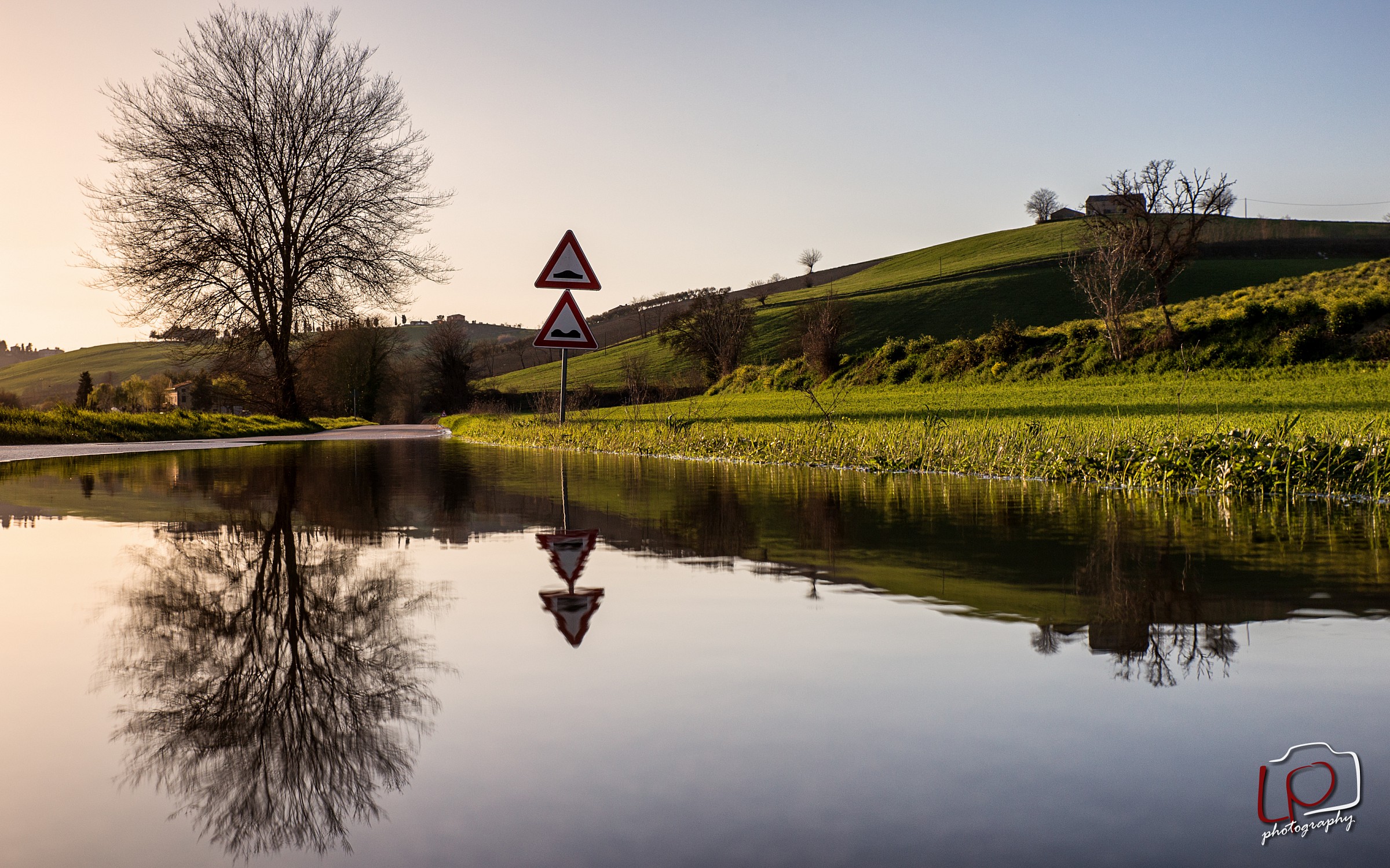 A lake in a narrow street flooded with water ...