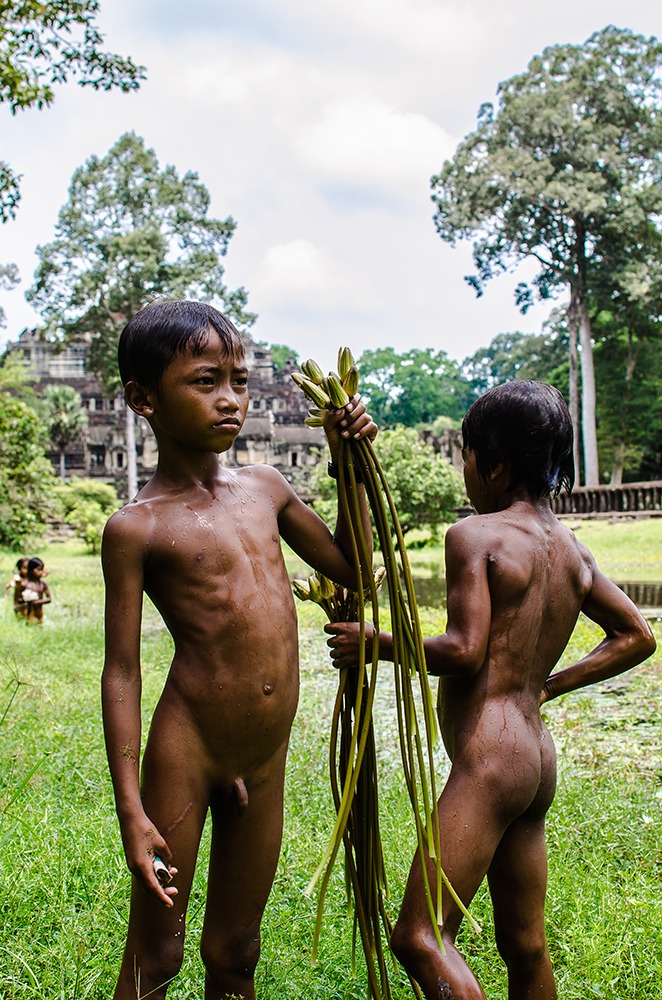 Children fishermen of lotus flowers