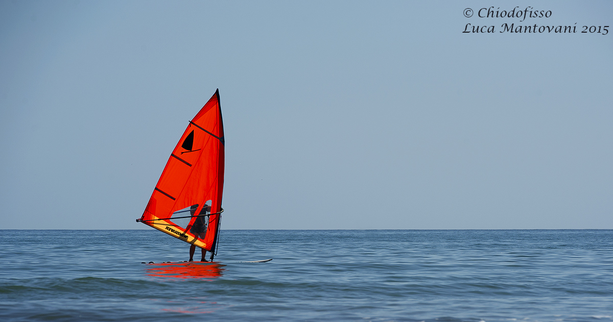 A color sail on the sea