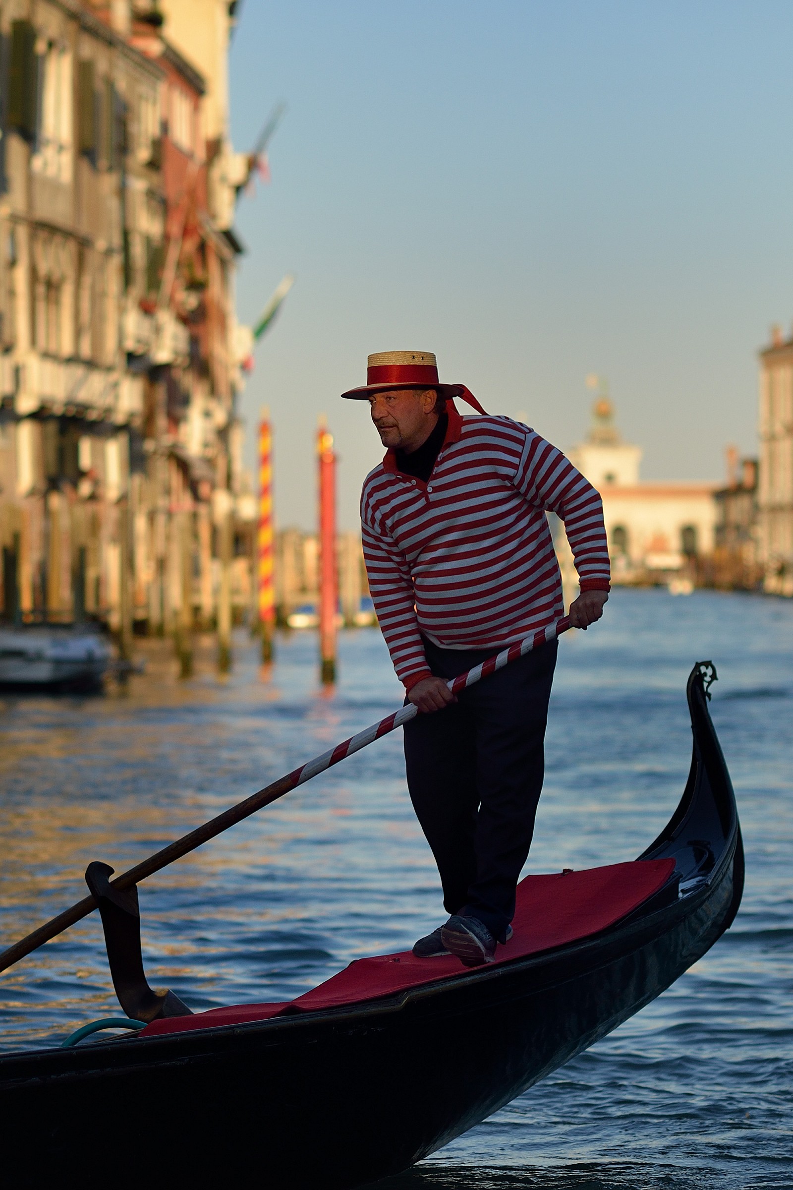 Gondolier on the Grand Canal at sunset