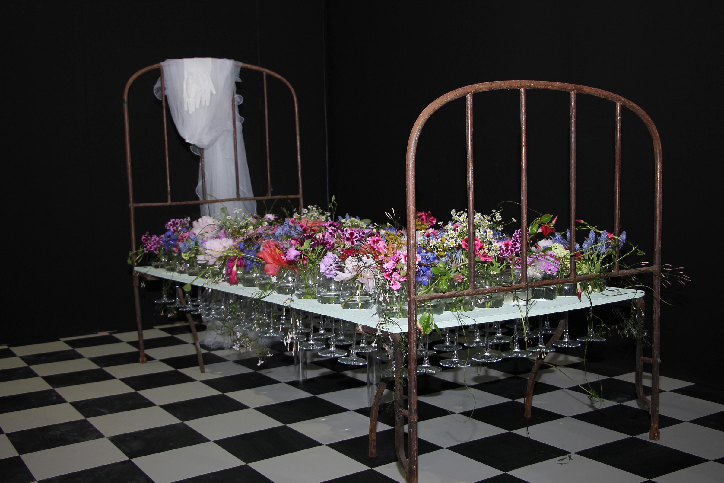 bed of flowers and goblets