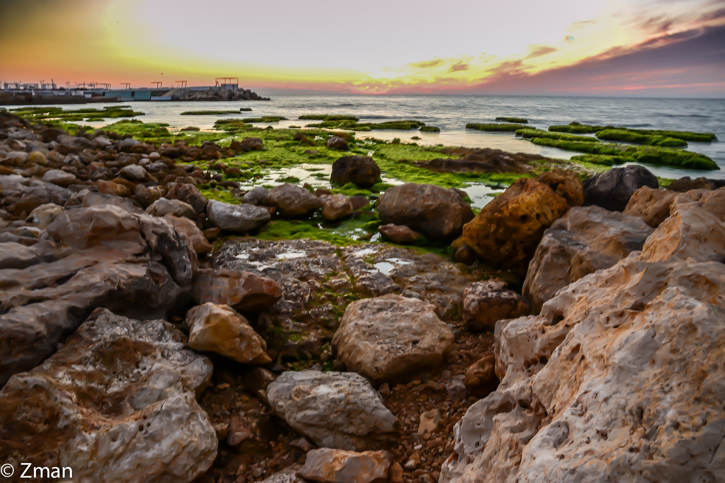 Al Manara Rocky Beach at Sunset