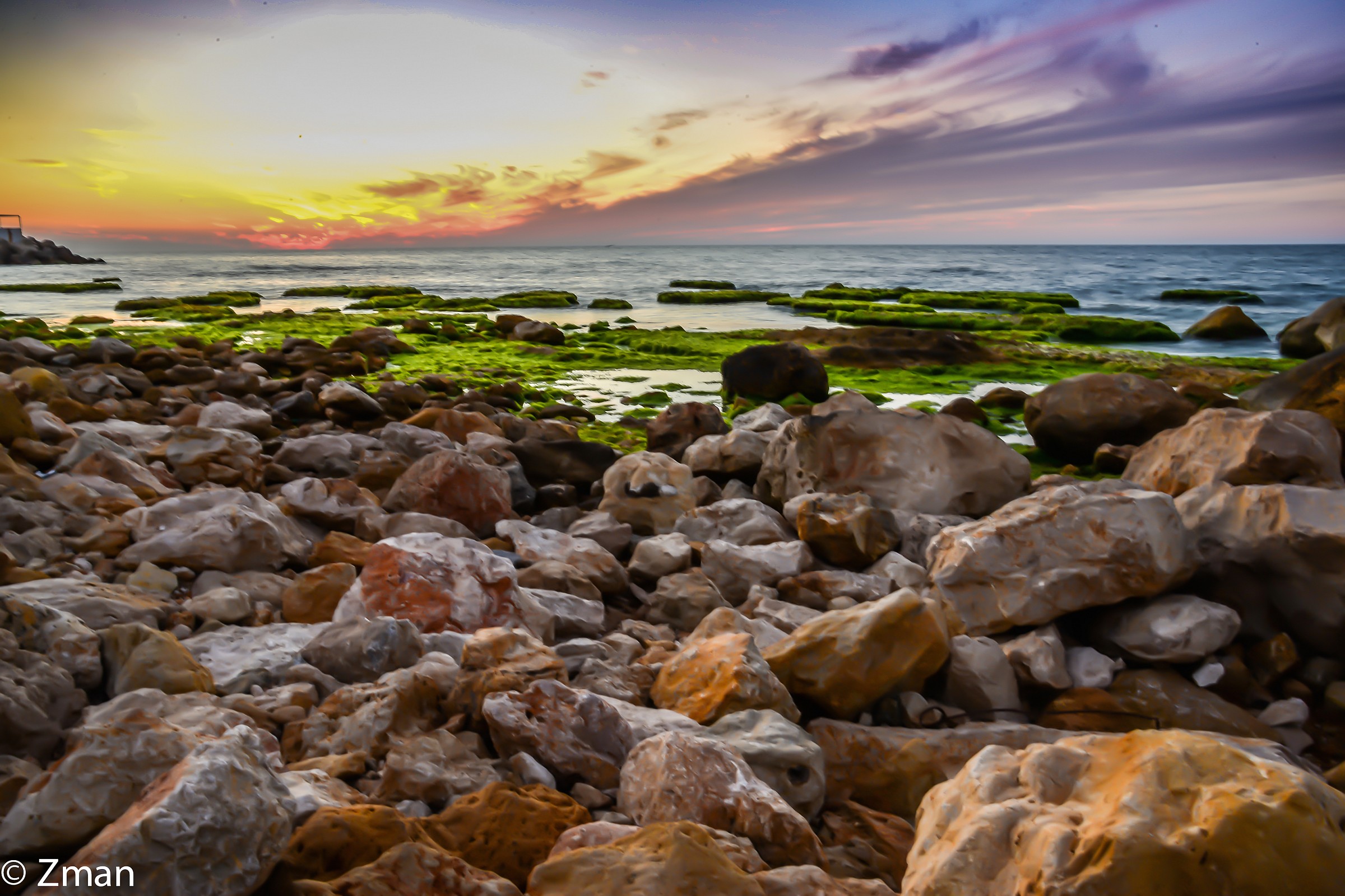 Al Manara Rocky Beach at Sunset