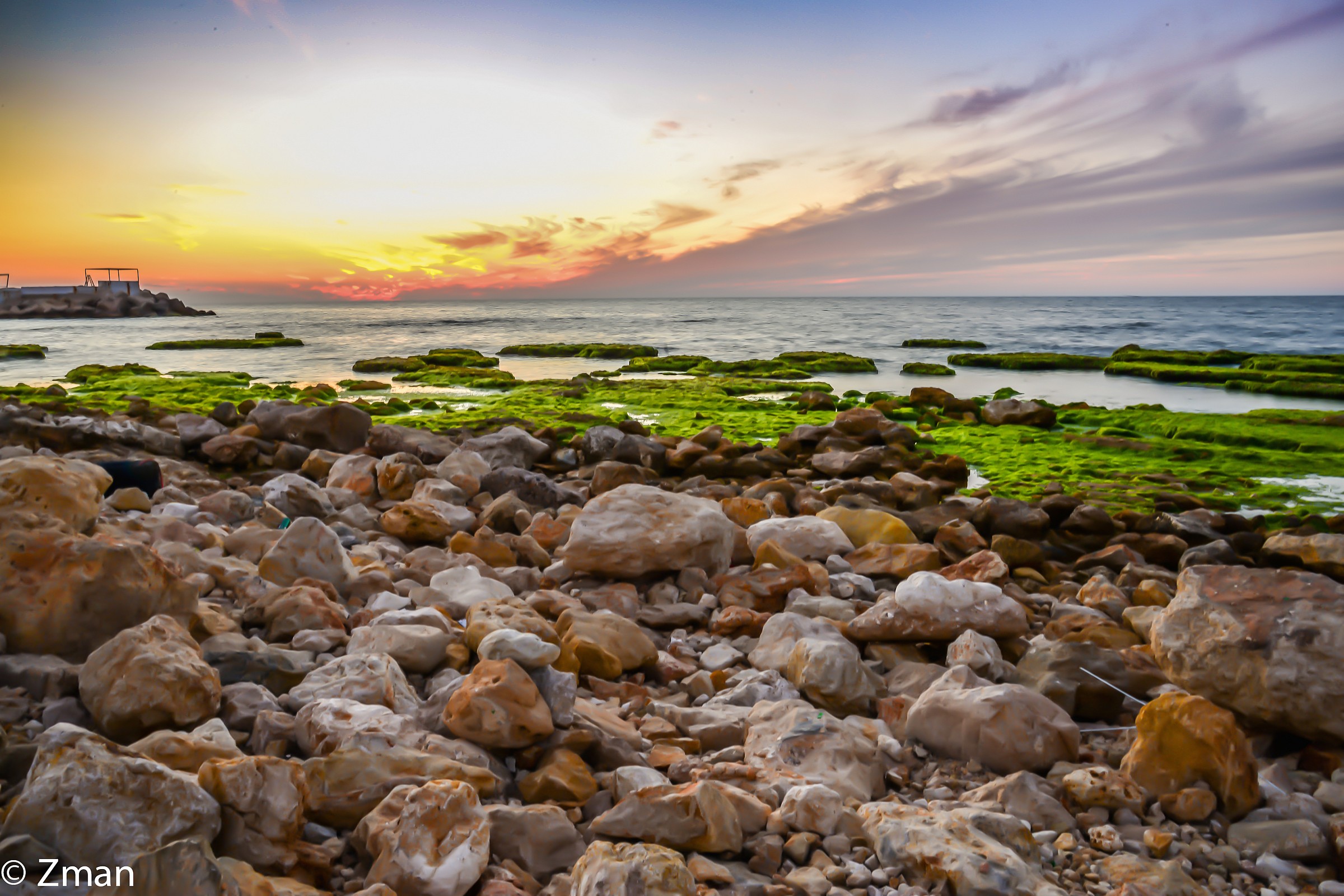 Al Manara Rocky Beach at Sunset