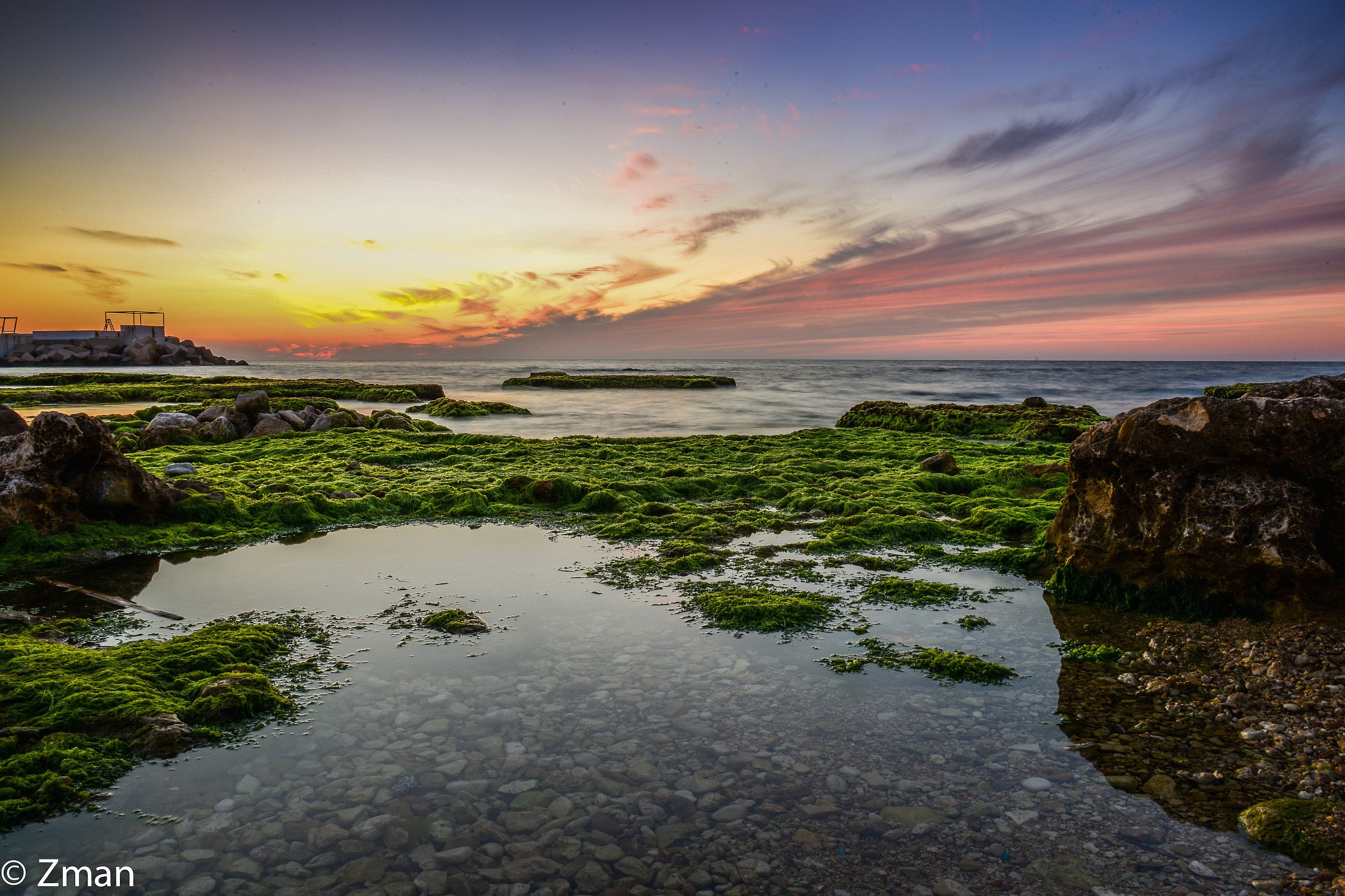Al Manara Rocky Beach at Sunset