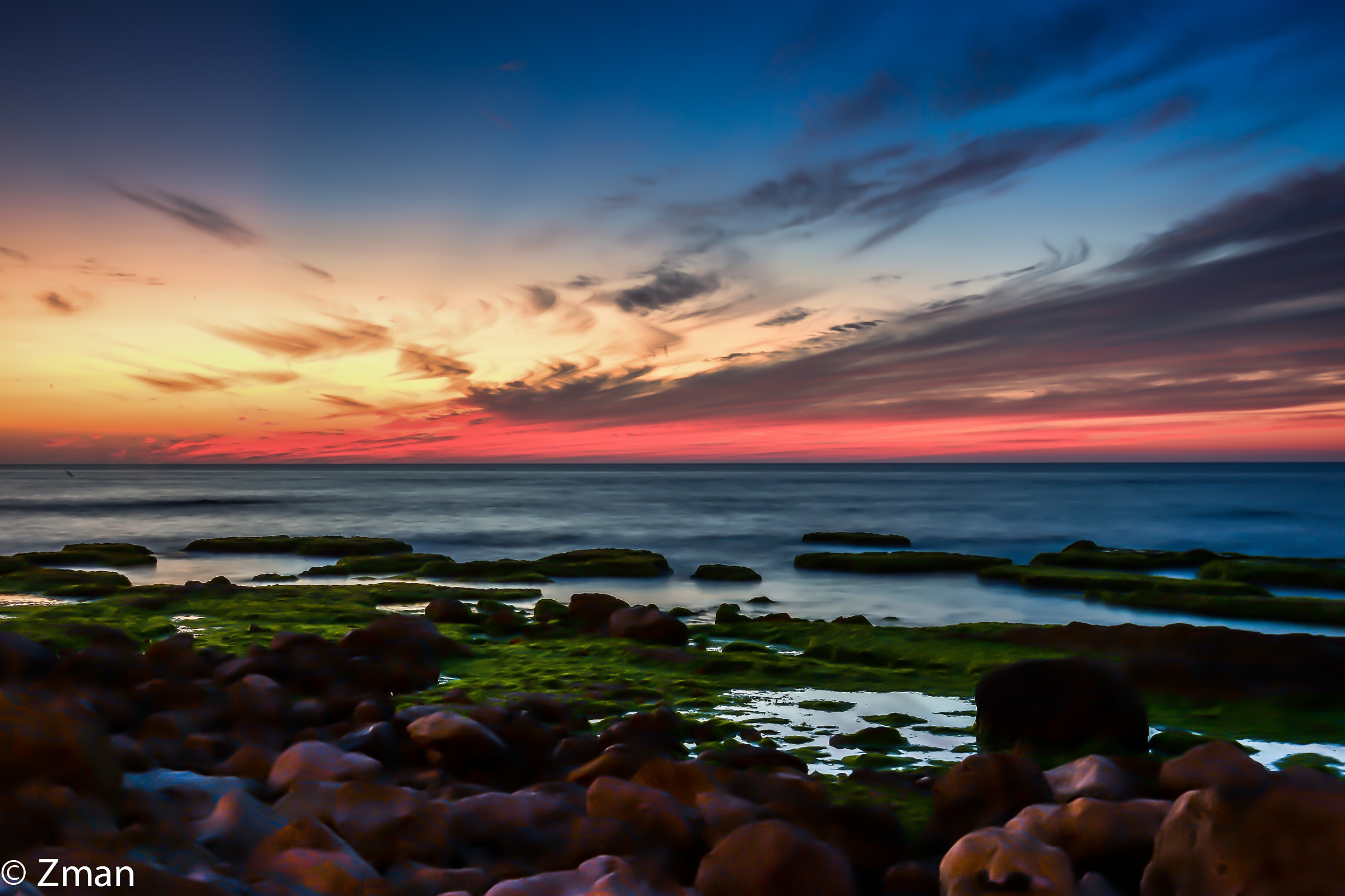 Al Manara Rocky Beach at Sunset