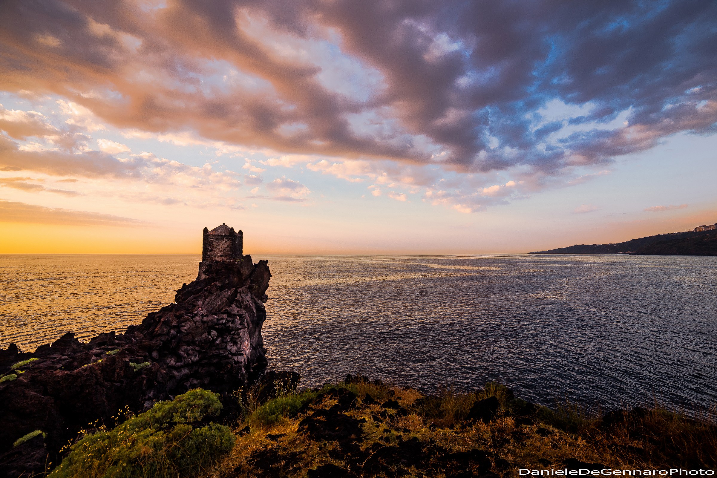 The tower timpa the sea clouds lava stone