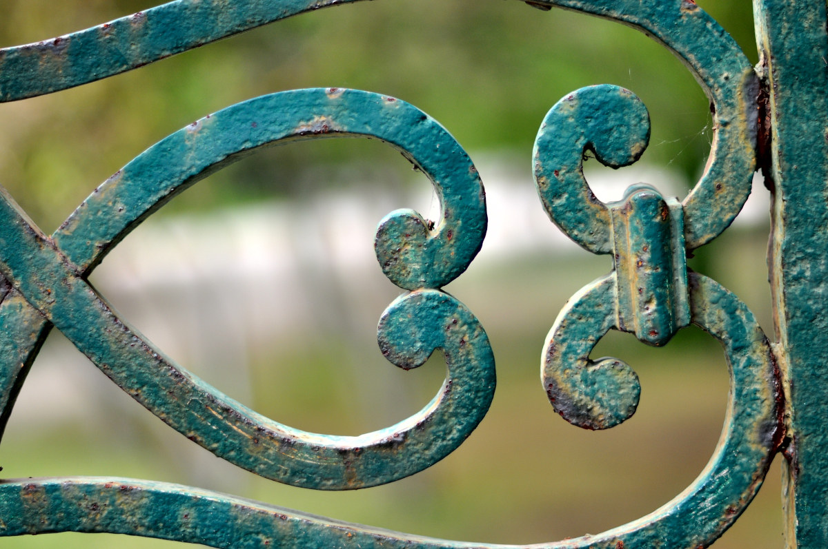 Detail of an old wrought iron railing.