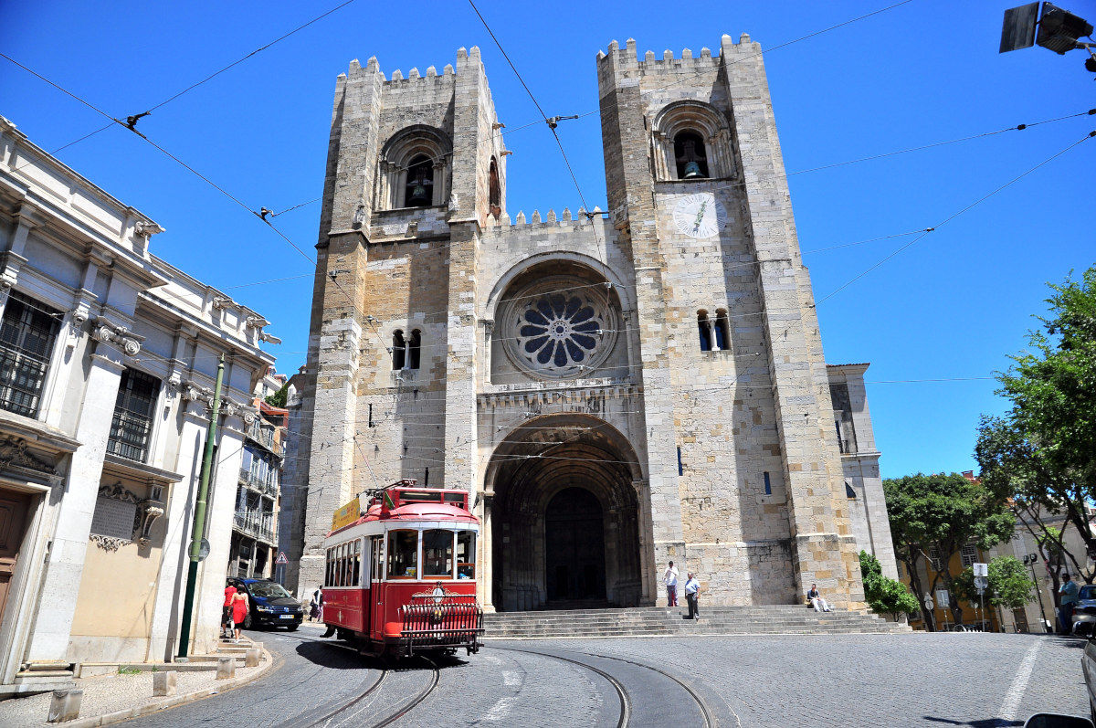 Old tram in front of the Cathedral of Sé.