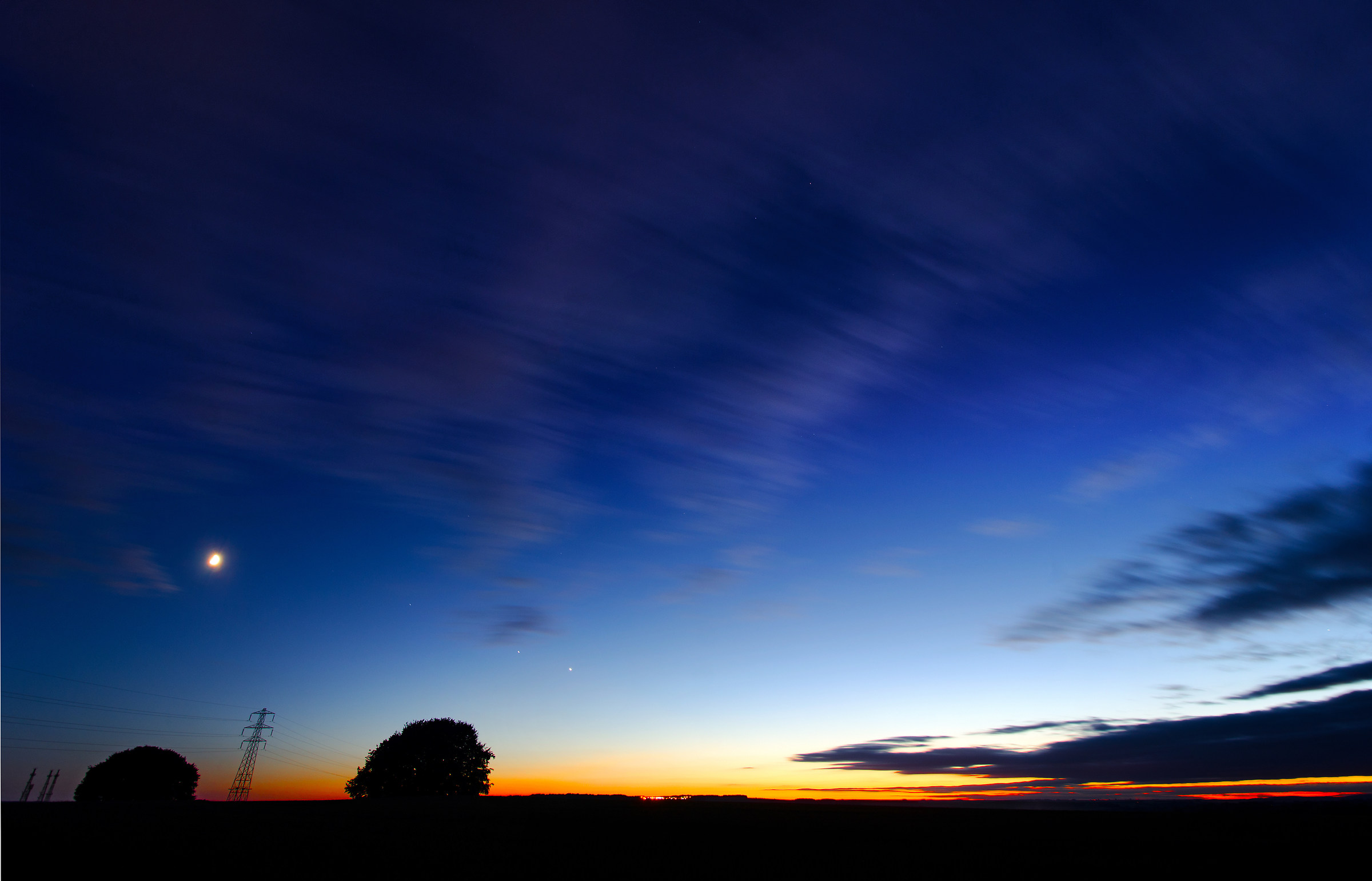 Sunset, Moon, Pylon, Radio Masts and clouds