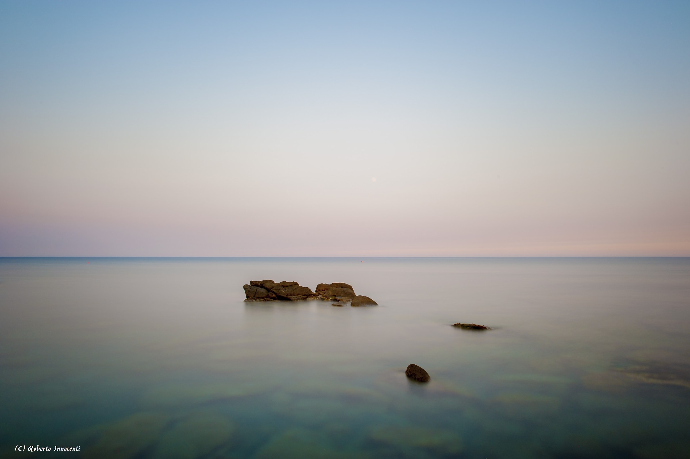 Seduto su uno scoglio al tramonto(Bordighera)