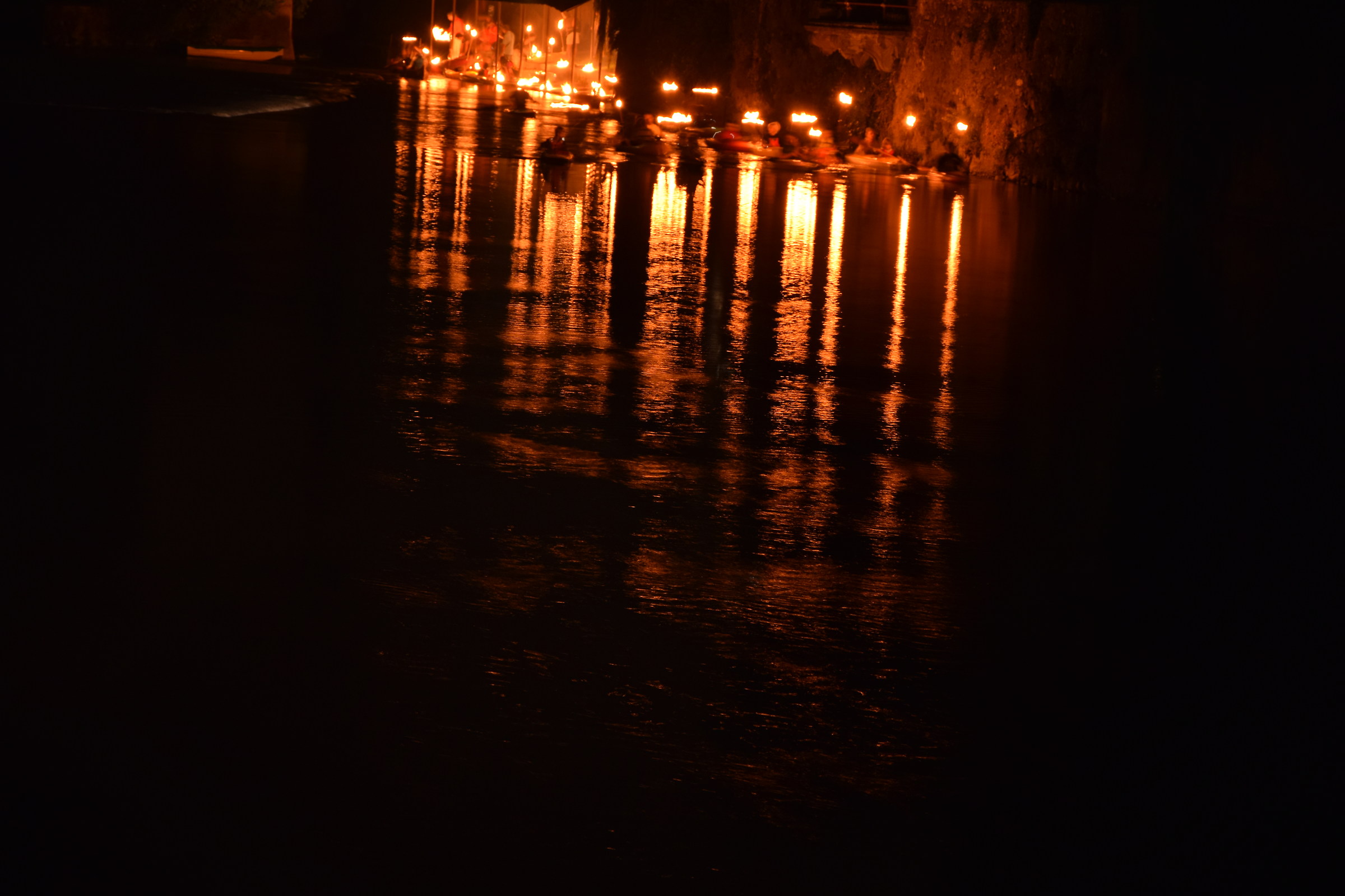 torchlight procession on the river Oglio
