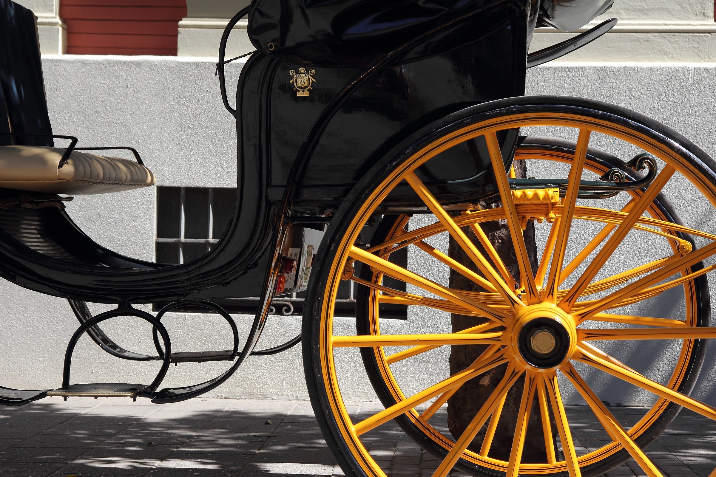 Carriage by yellow wheels in Seville