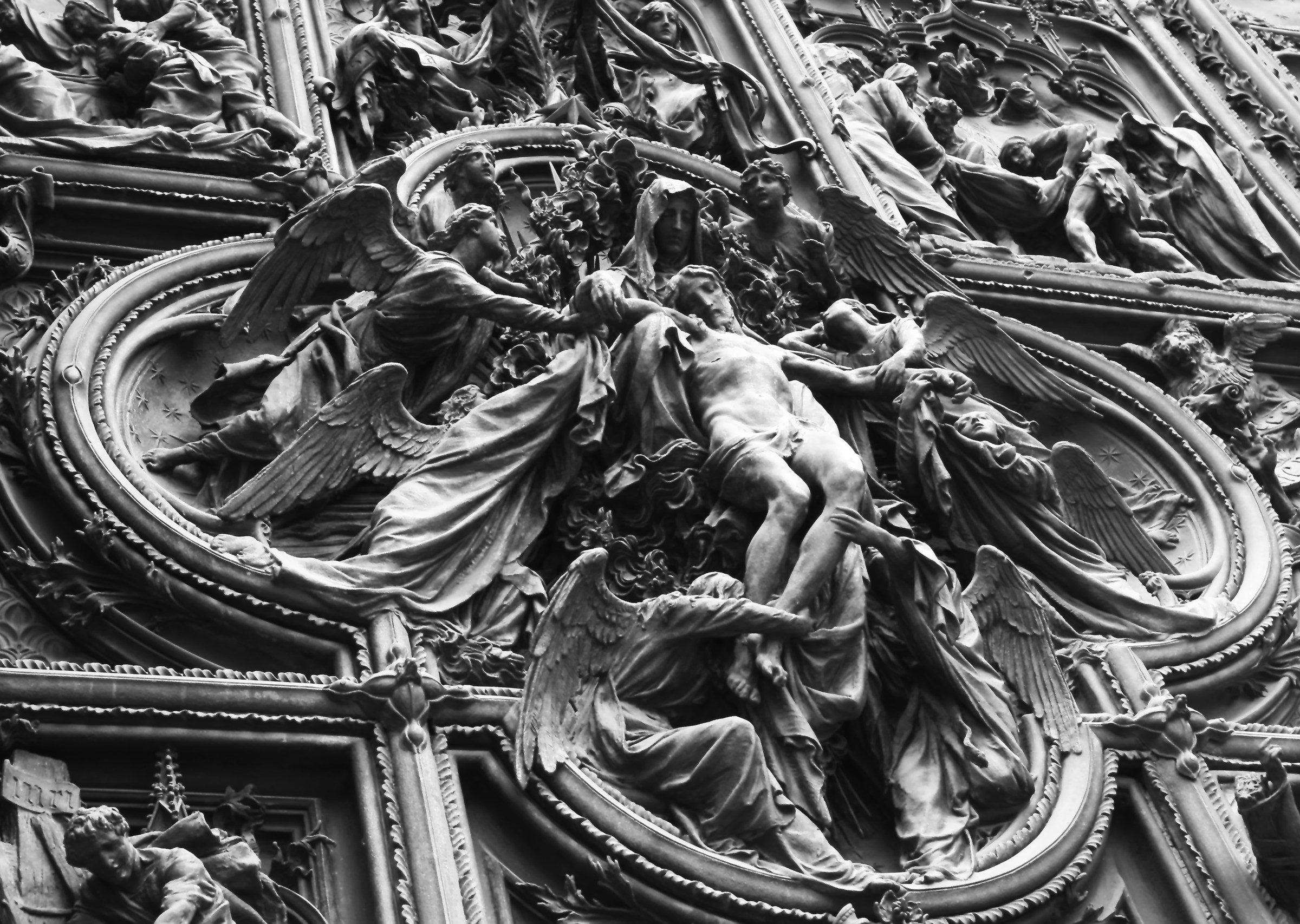 Pity on the door of the cathedral of Milan
