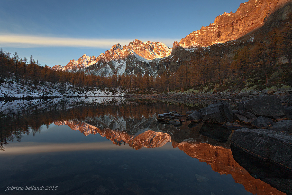 Even the larches are reflected.