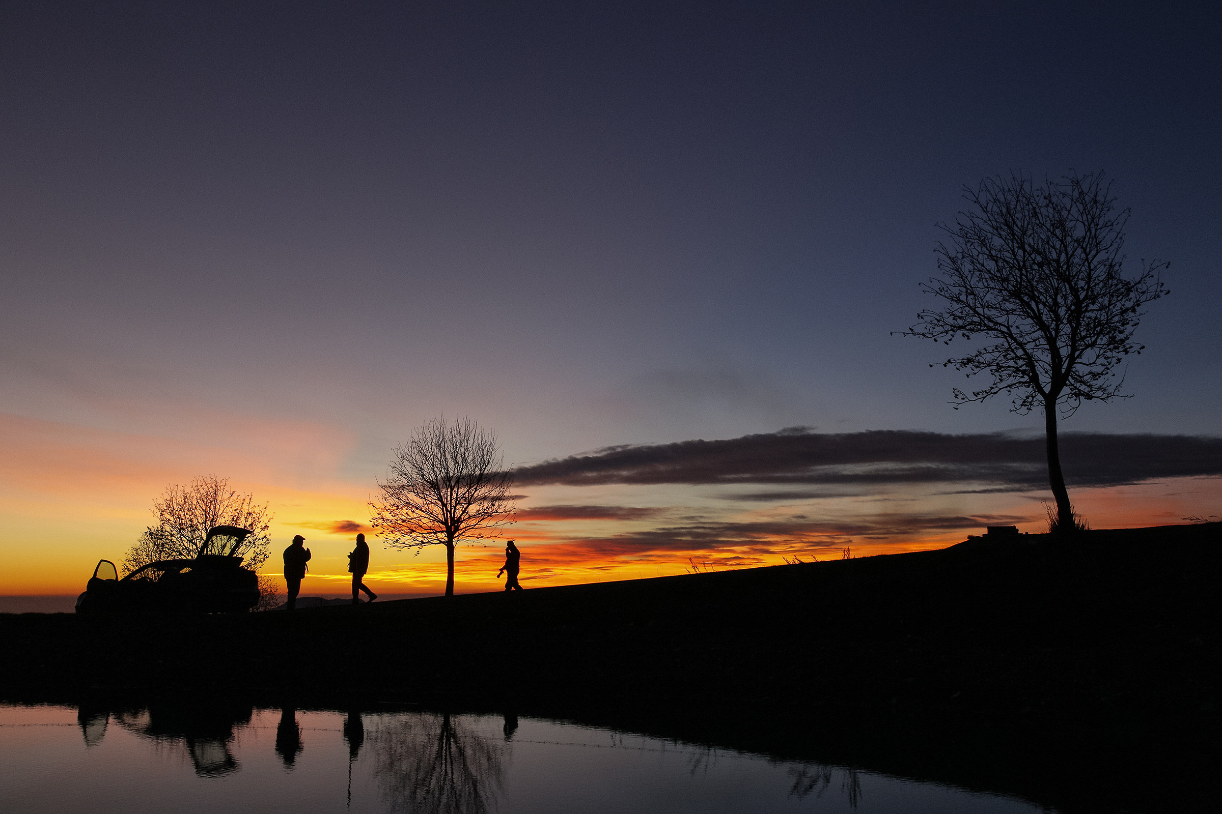 photographers at sunset