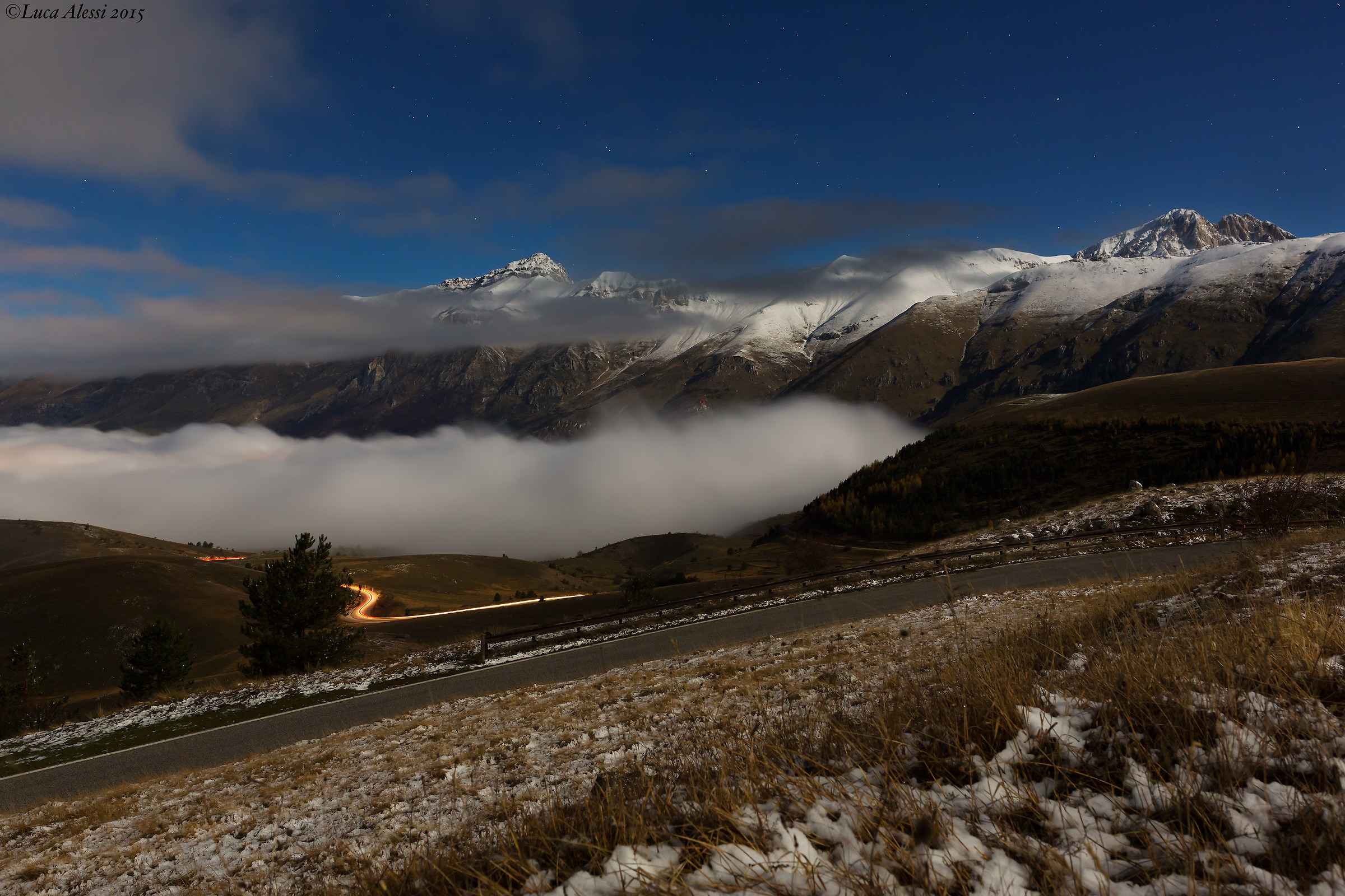 Mountains snow clouds and stars