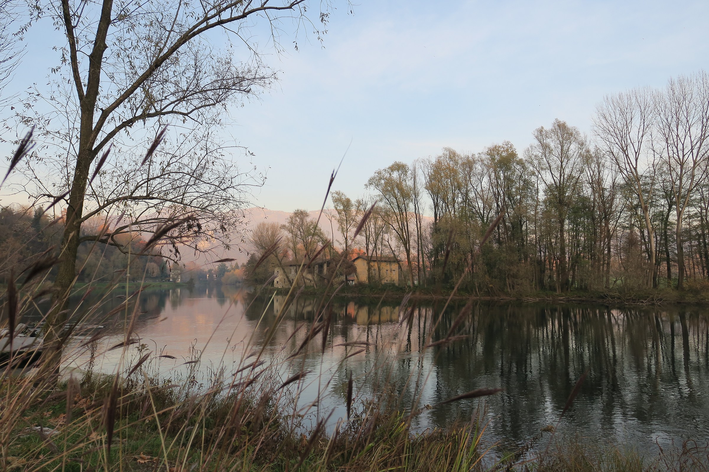 Sunset along the Adda with cottage