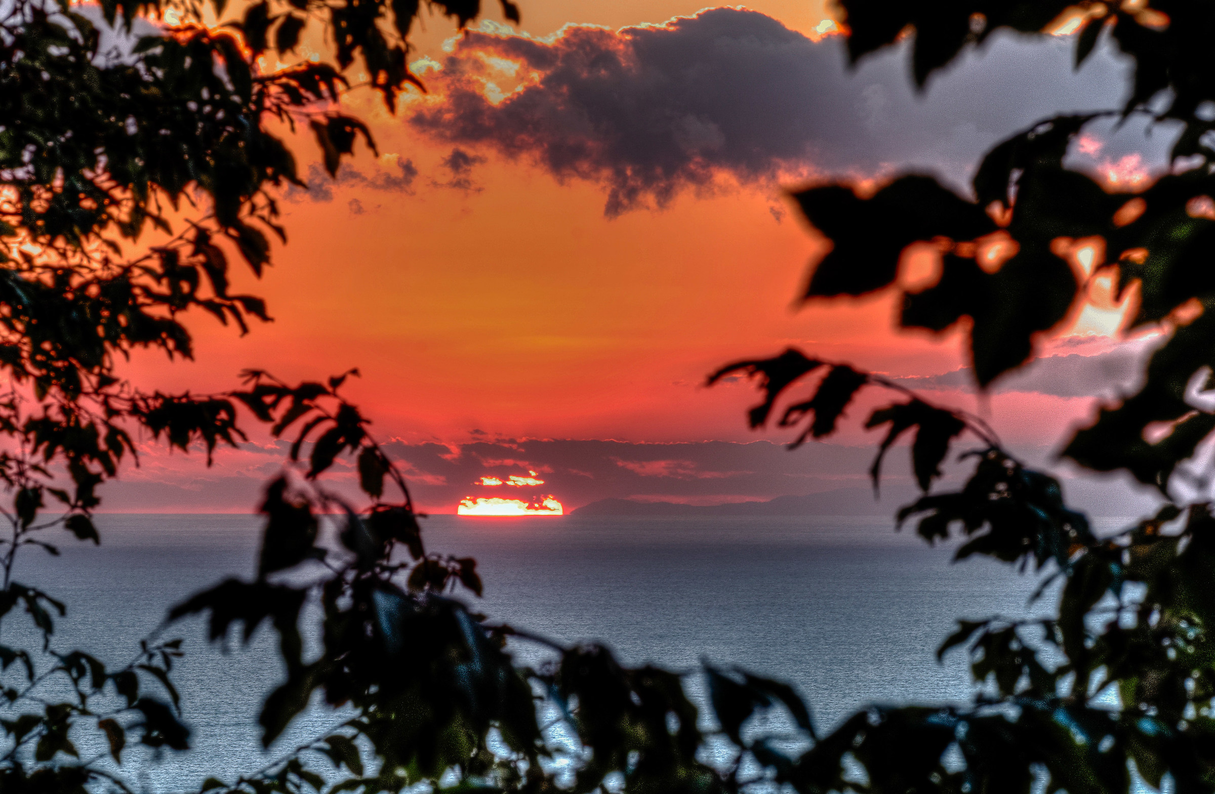 Sunset and final part of the Ligurian coast in the west