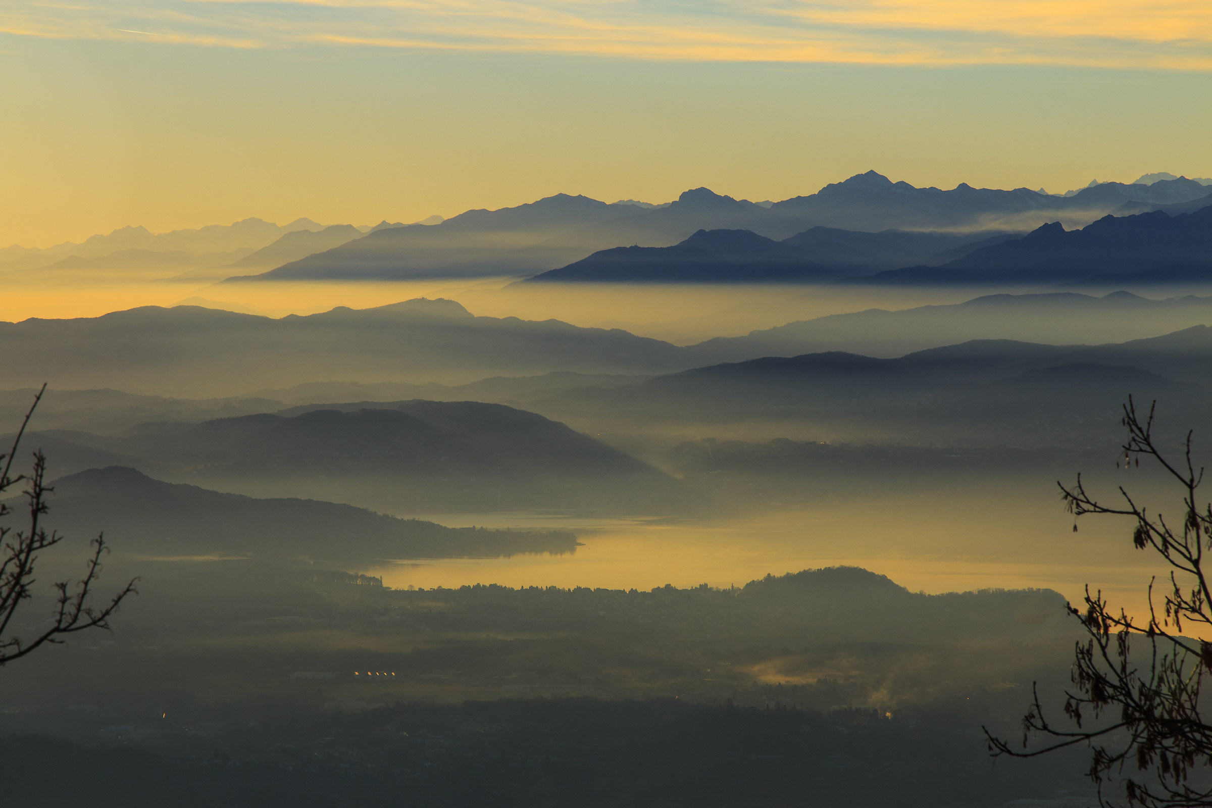 The lake and the mountains fall asleep through the haze.