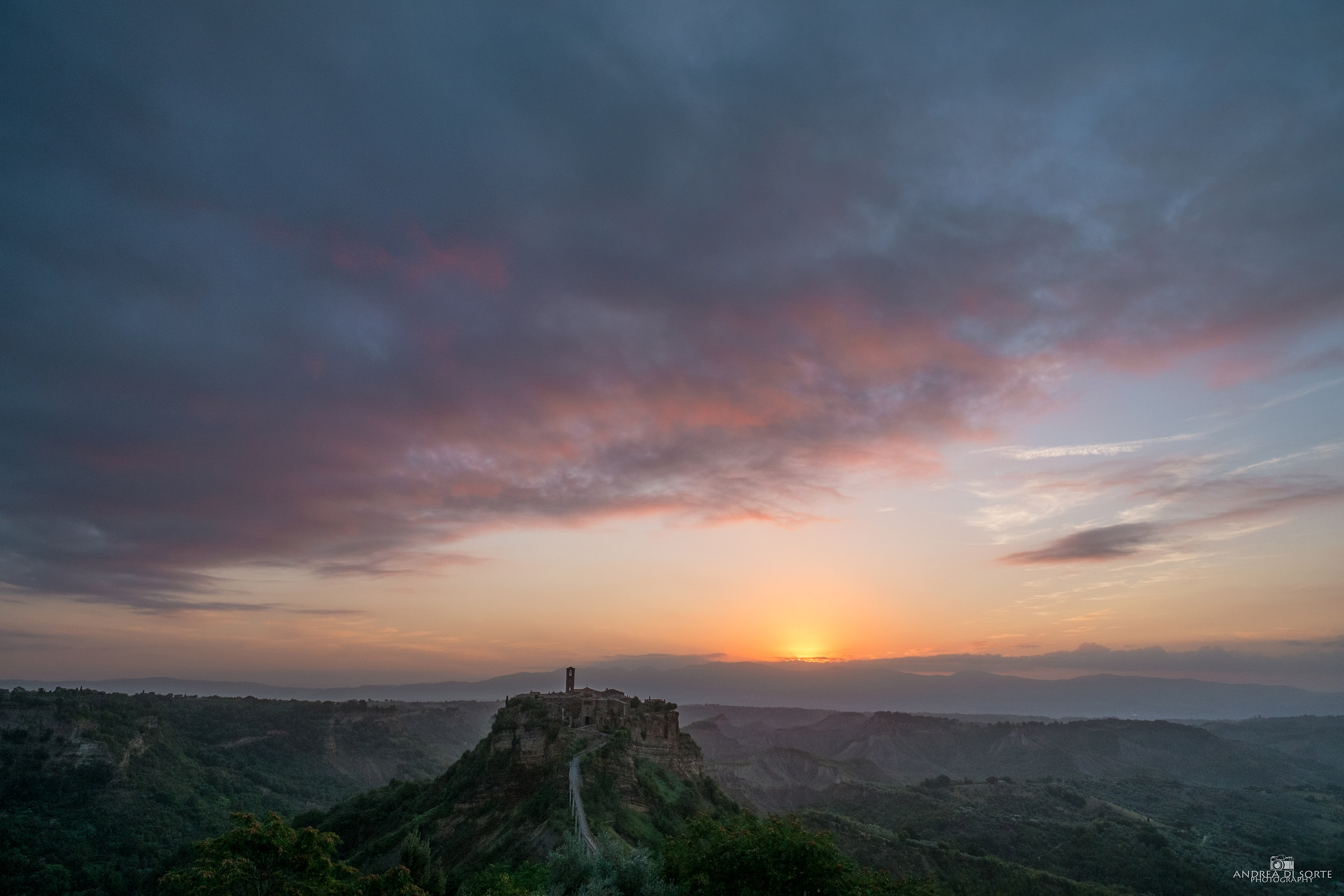 The sun rises over the city that dies