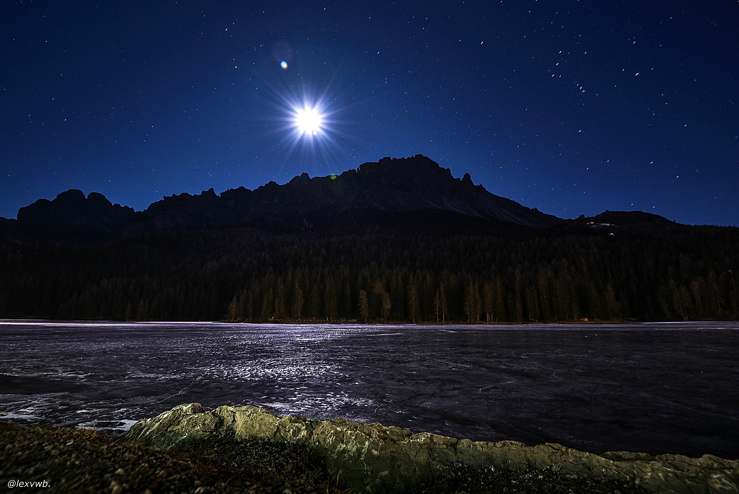 reflections of the moon on the lake ice