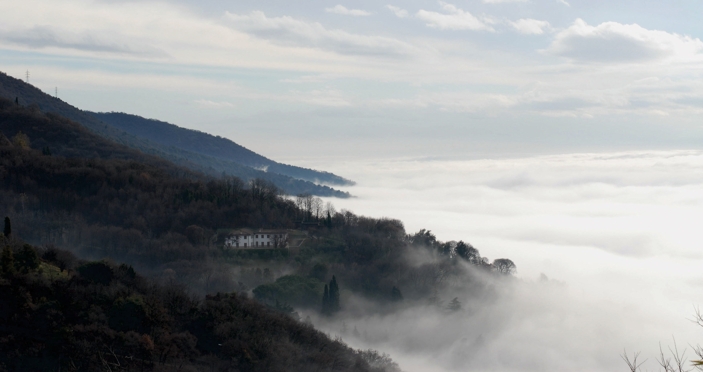 Here, between the fog and the hill