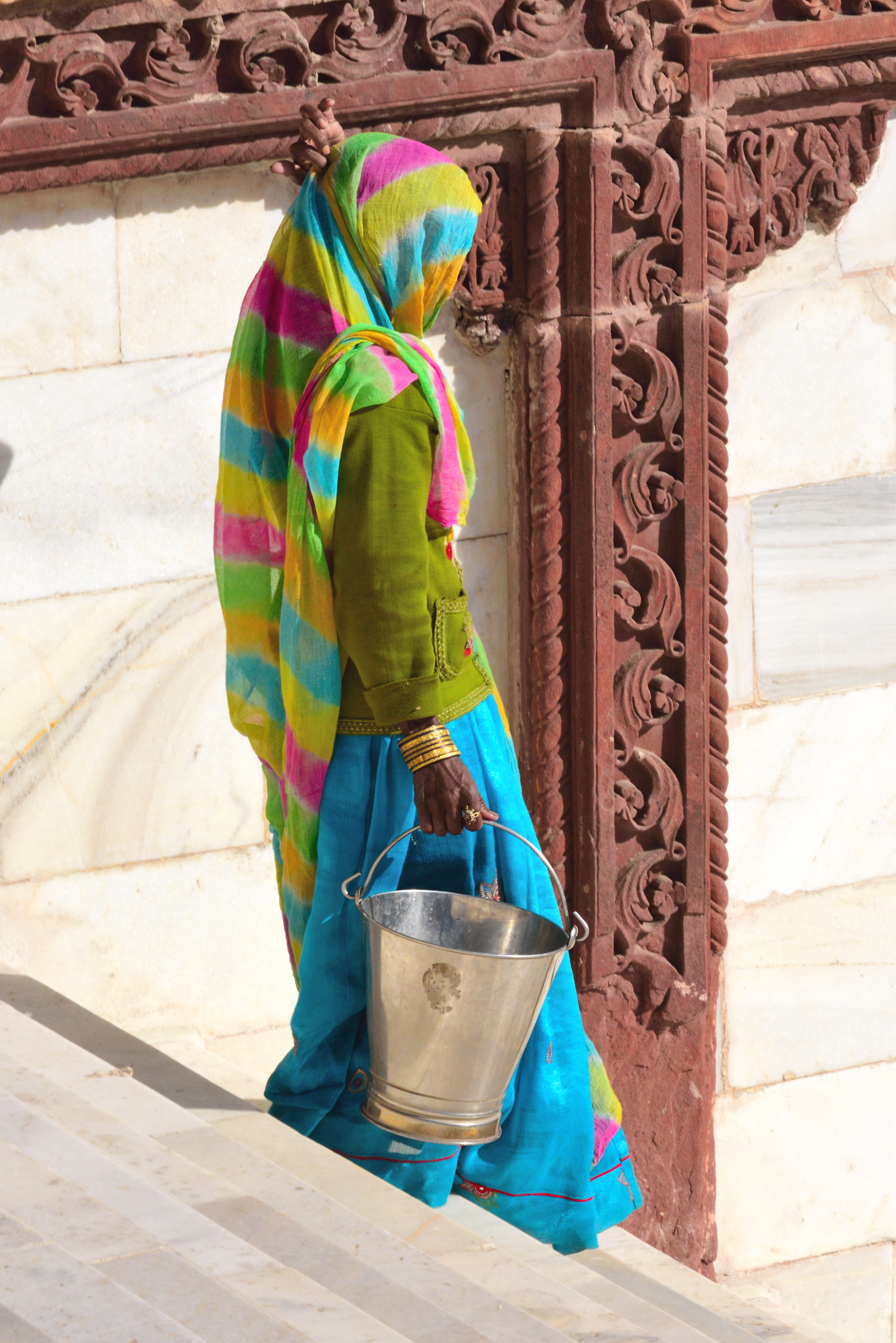Woman carrying a bucket