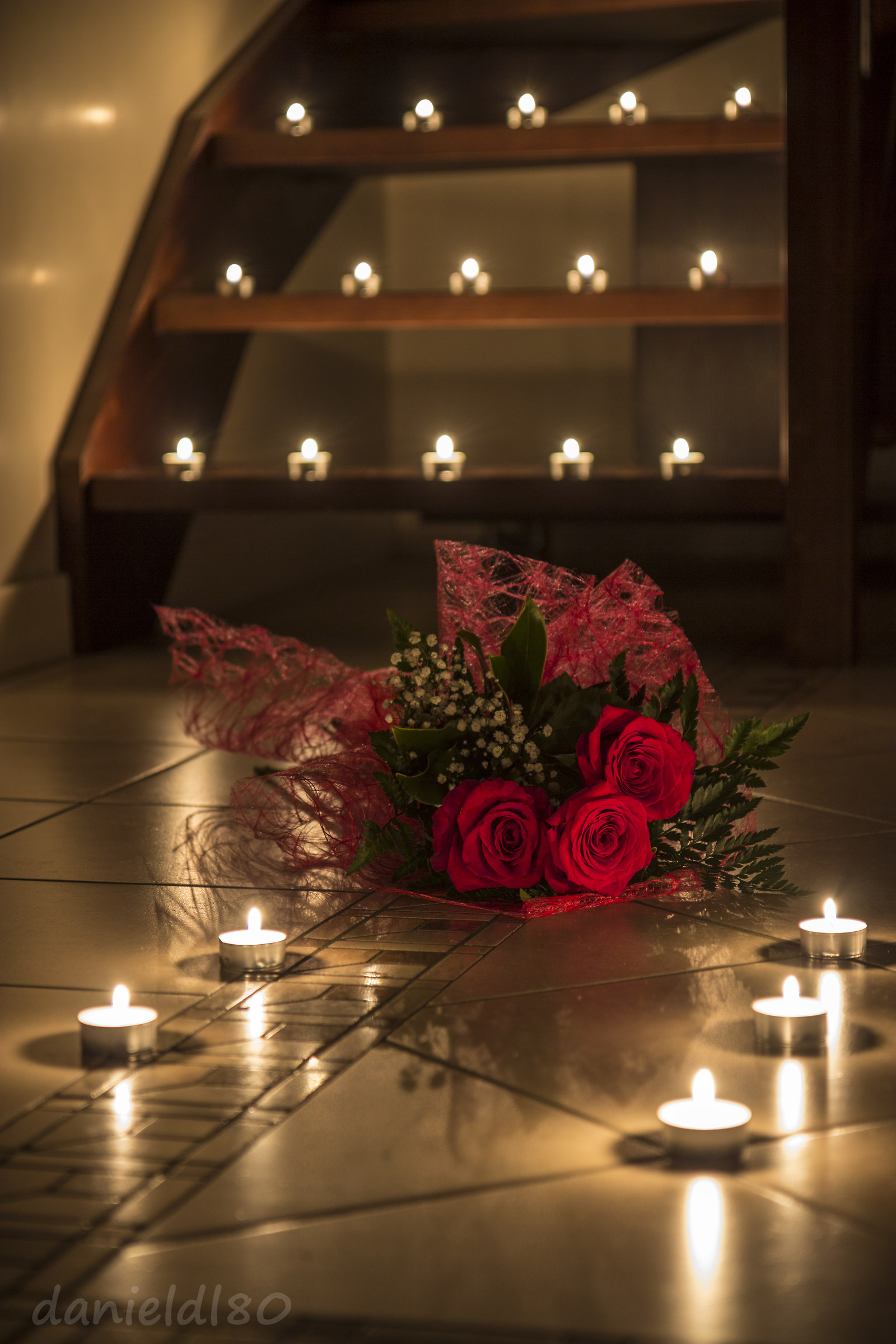Red roses by candlelight