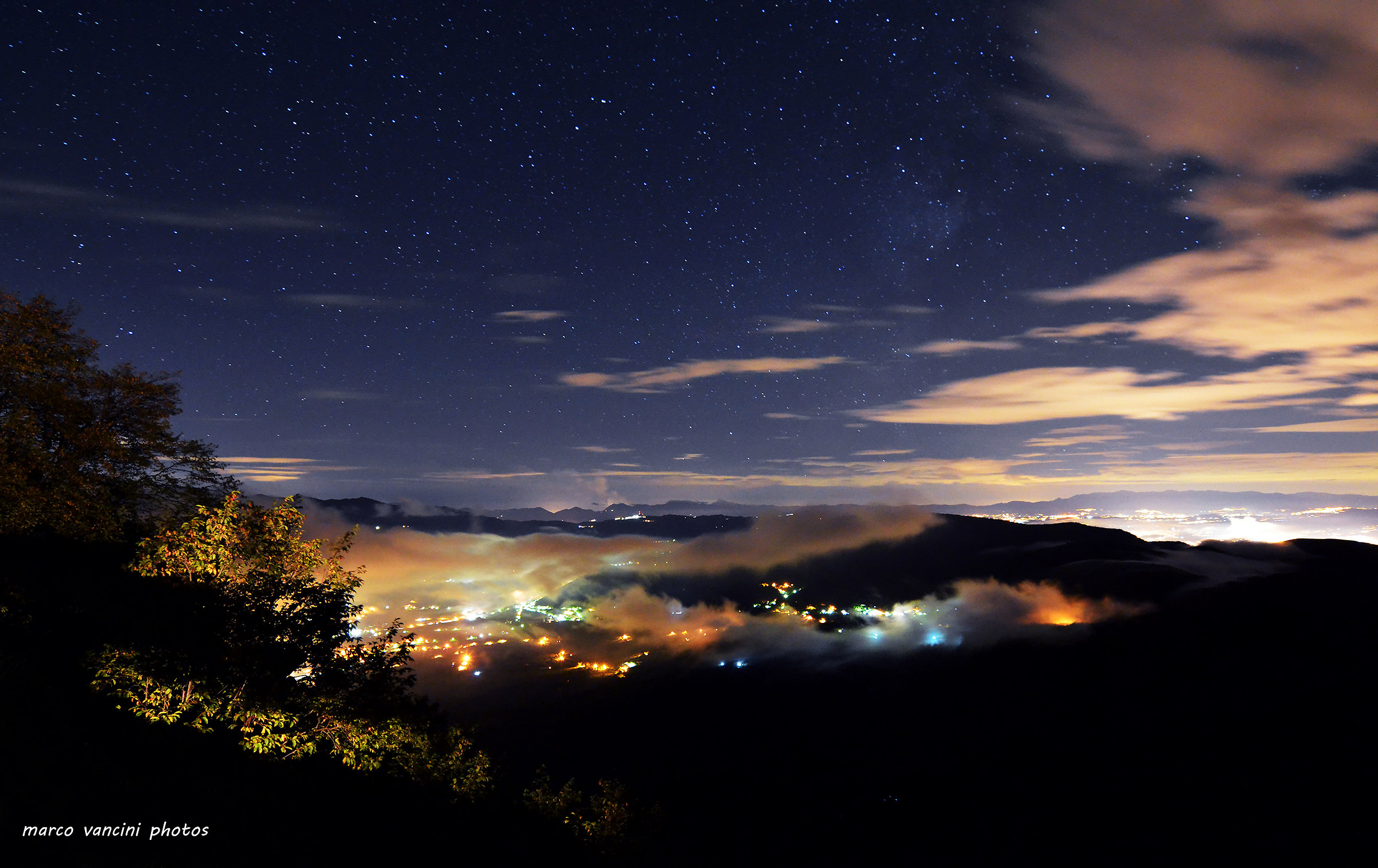 night lights shrouded by clouds