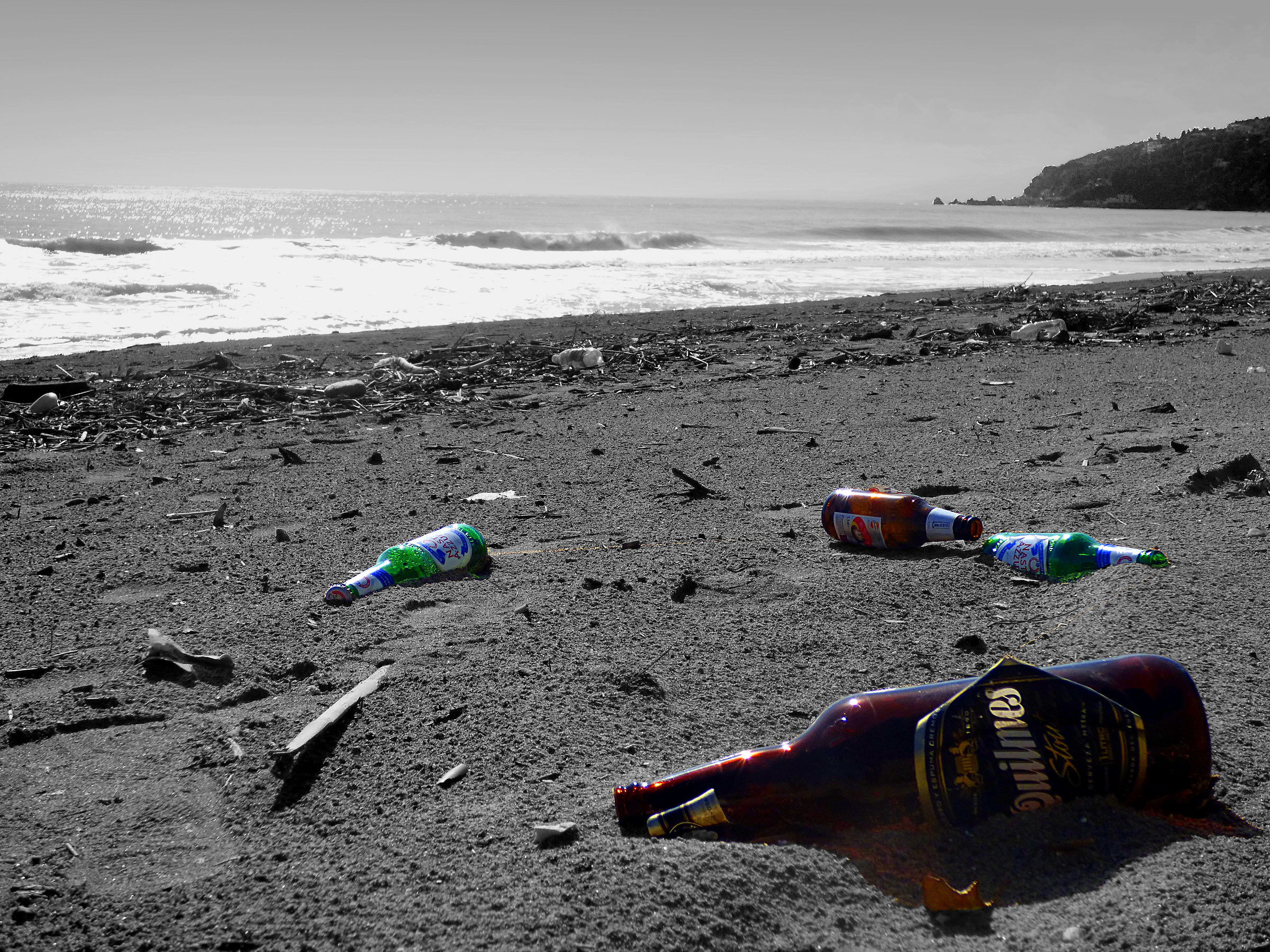 Gray beach under the beer. No message in the bottles..