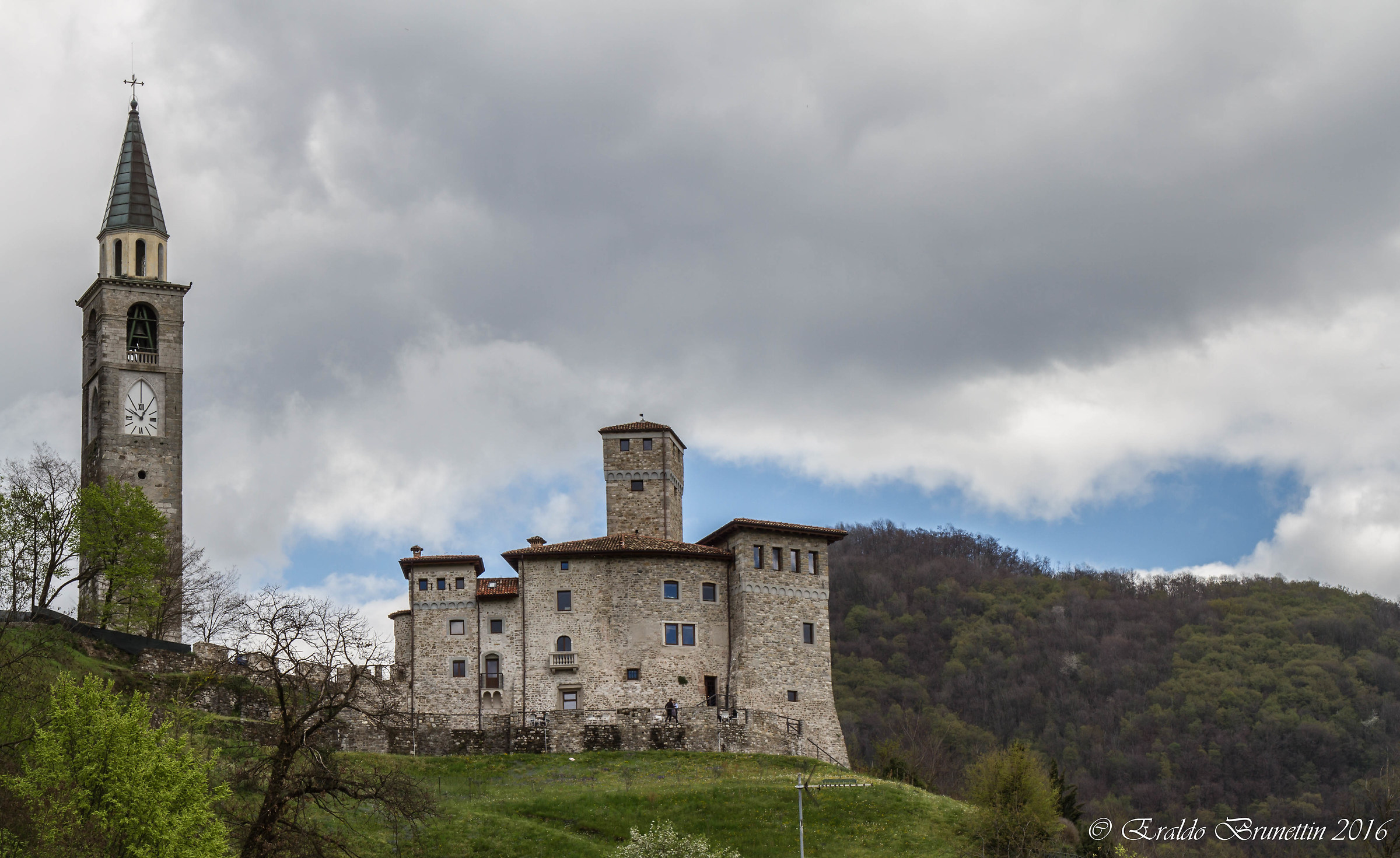 Artegna Castle (ud) and the bell tower of Santa Maria Nascen...