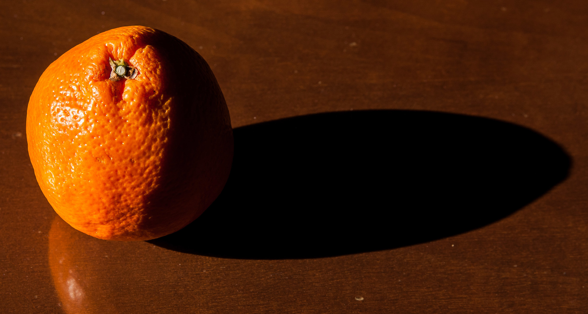 The long shadow of an orange .....
