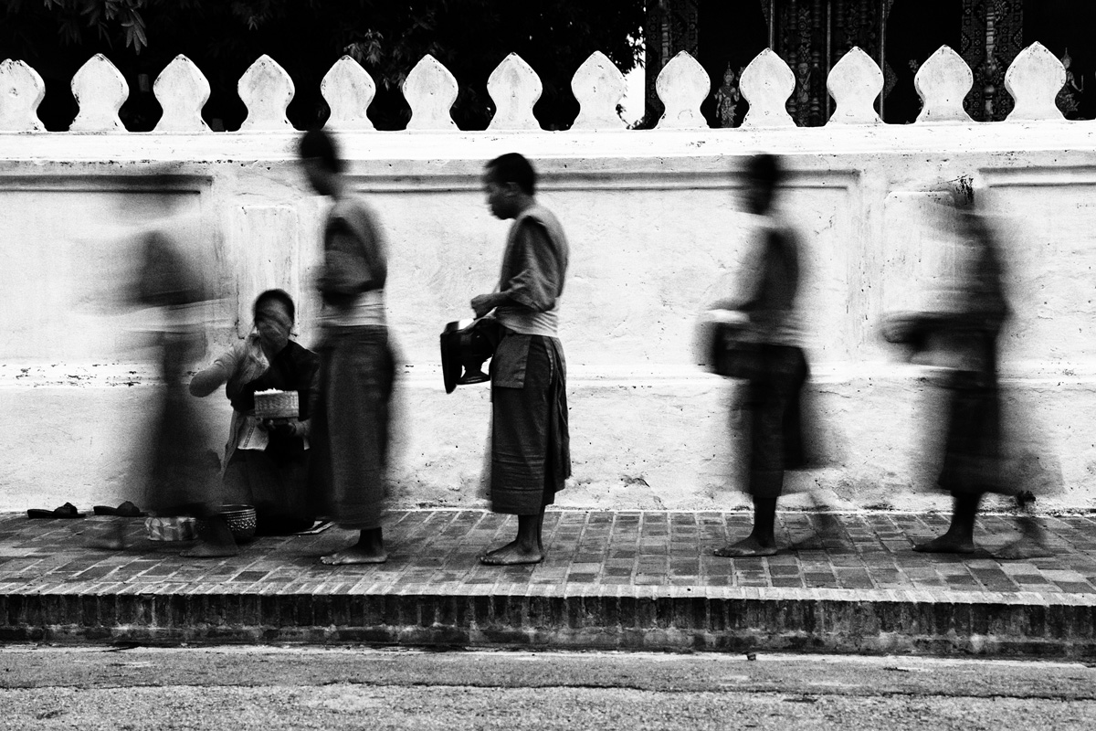 Monks collecting alms at dawn in Luang Prabang