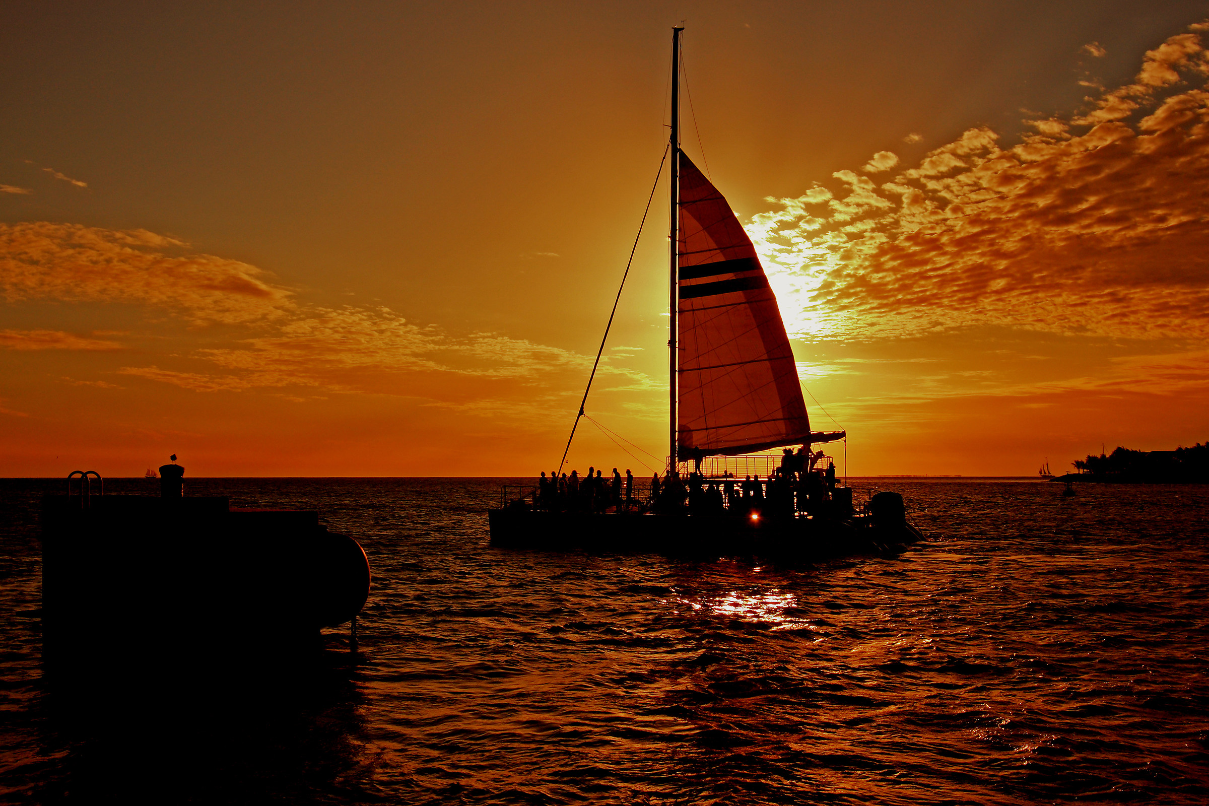 the sun behind the sail