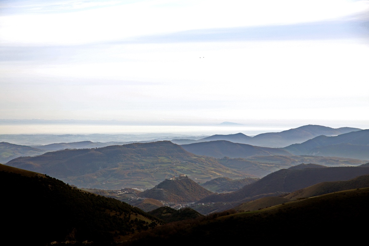 The Castle of Fronto and in the background the Conero